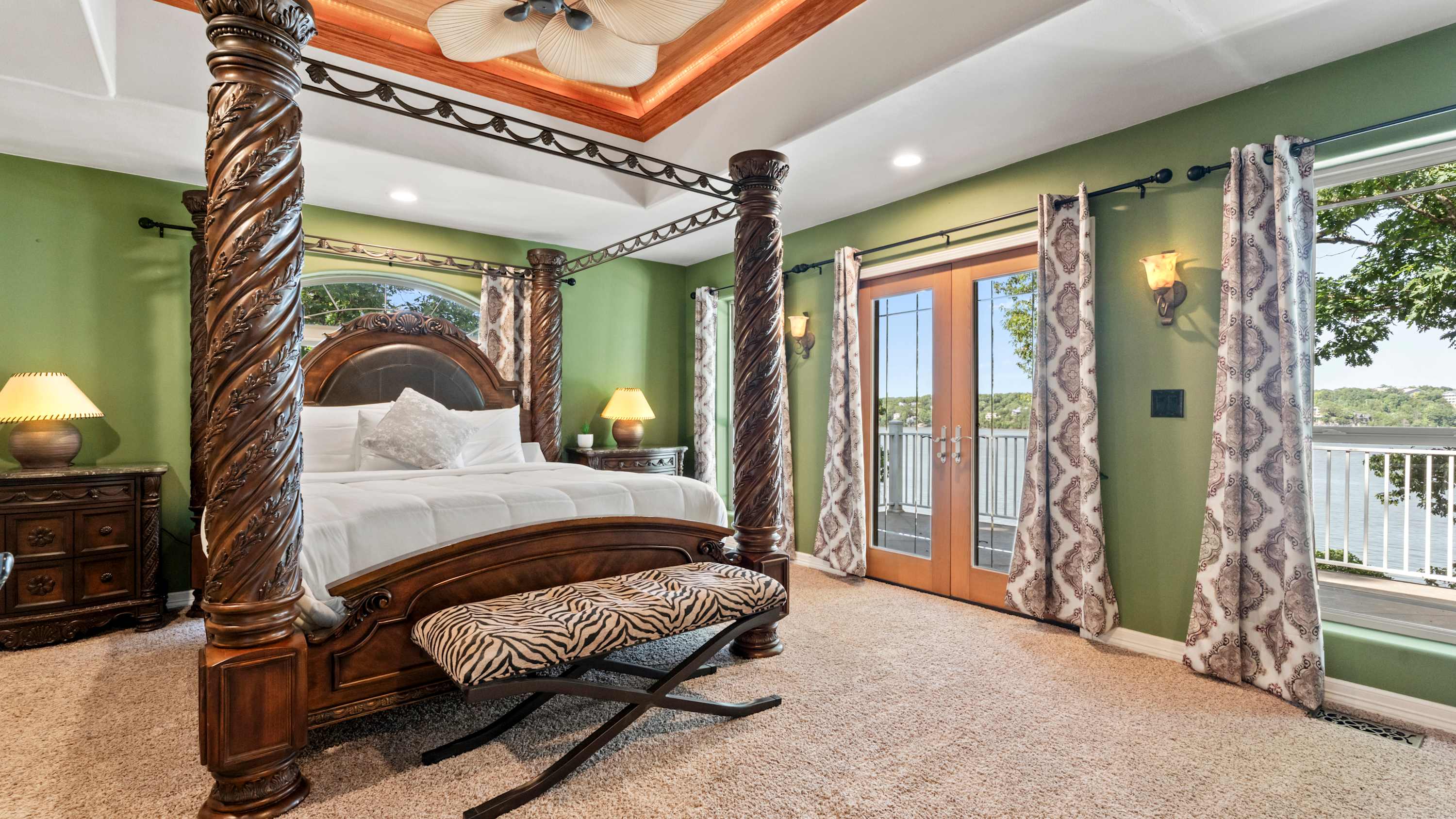 Recharge in the chic primary king suite, boasting a smart TV, ensuite, & deck access​