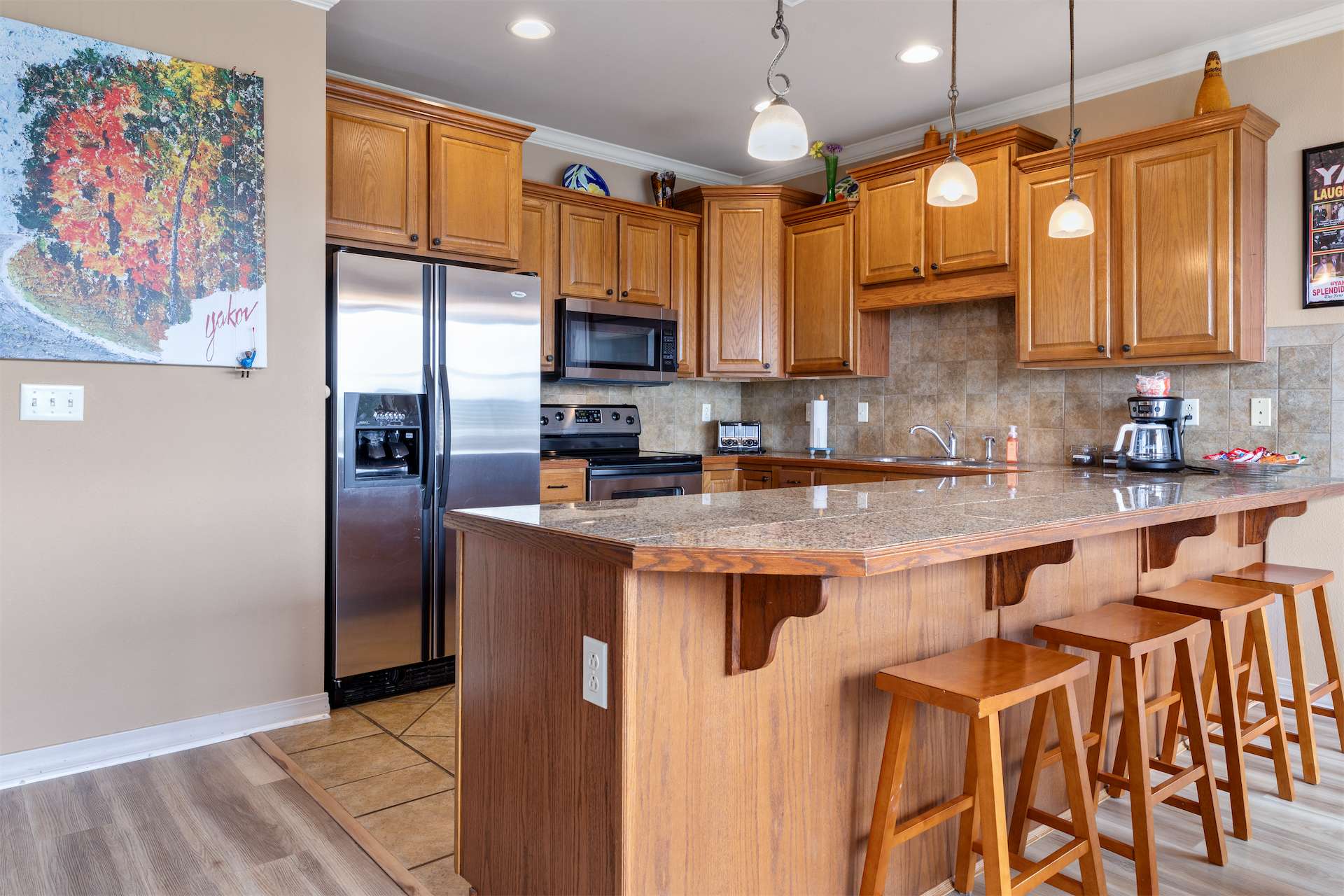 The open kitchen offers ample space & all the comforts of home​