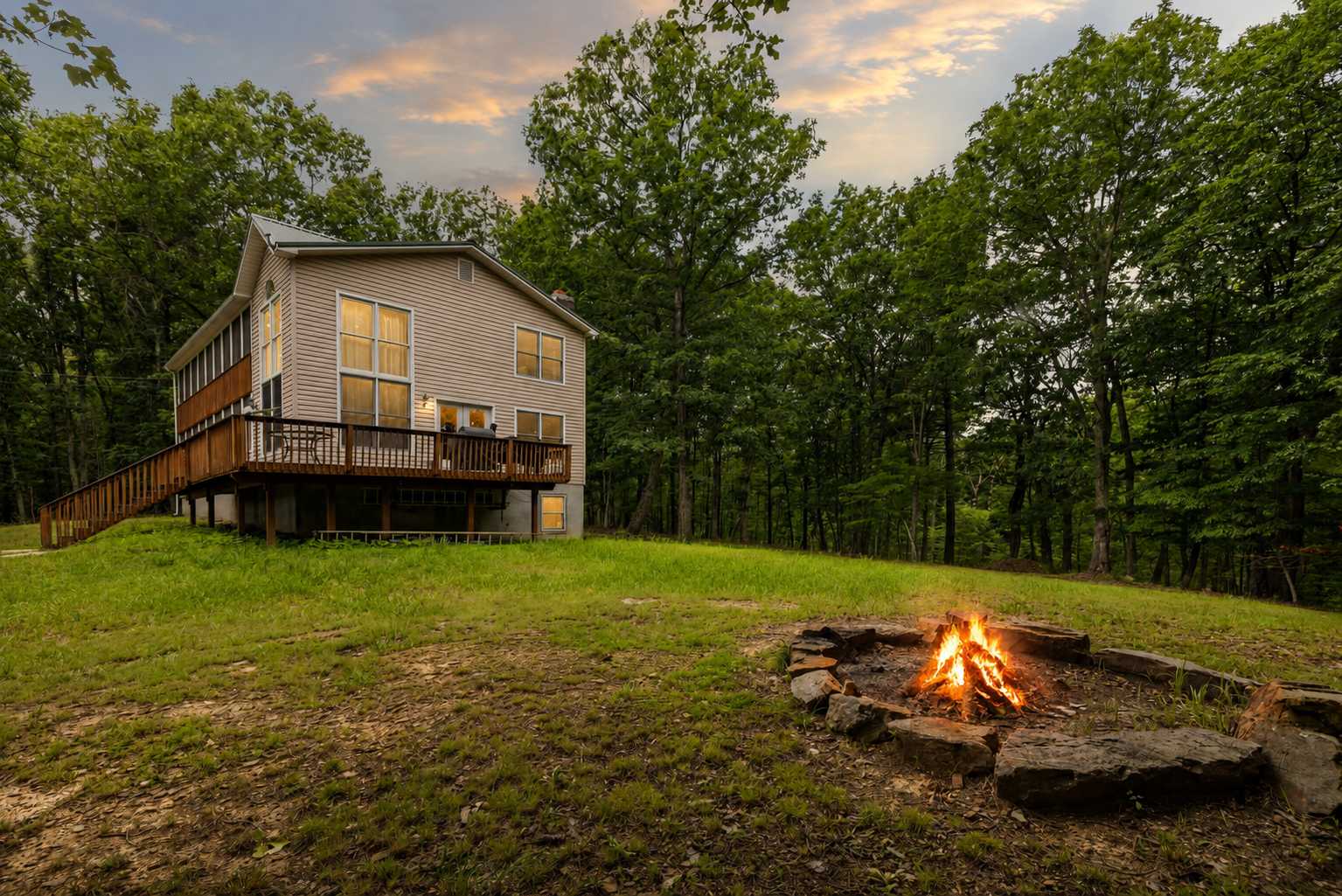 Gather around the wood-burning fireplace, enjoy evenings by the fire pit, or explore nearby river access just a mile away. Perfect for families and groups seeking a peaceful getaway.
