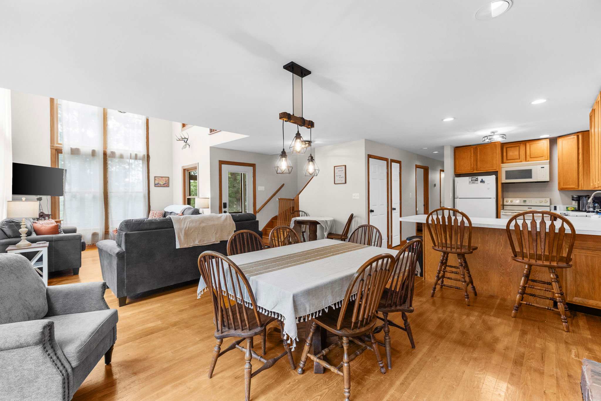 Spacious dining table, bar seating and a smaller table - plenty of room for gathering!