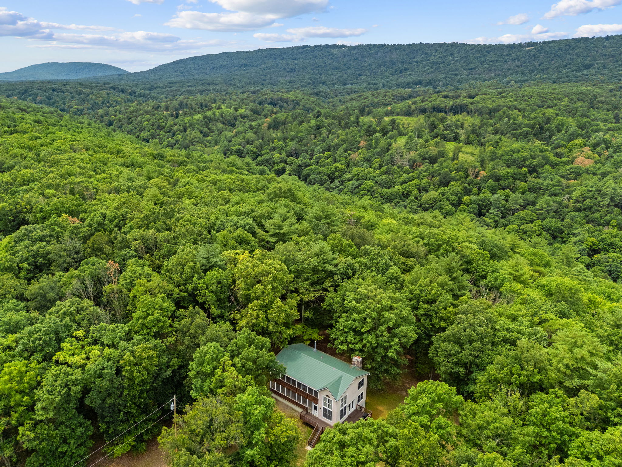 This home is perfectly located for enjoying some of West Virginia's best outdoor recreation. Just one mile from the cabin, enjoy community river access perfect for fishing, swimming, kayaking, boating, or simply unwinding by the water. 