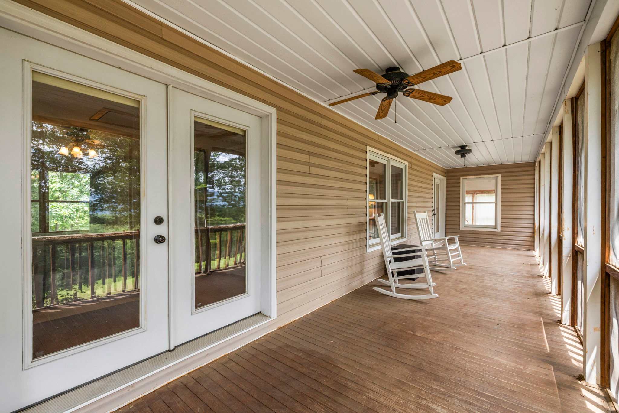 Upper & lower screened-in porches for relaxing in comfort, rain or shine