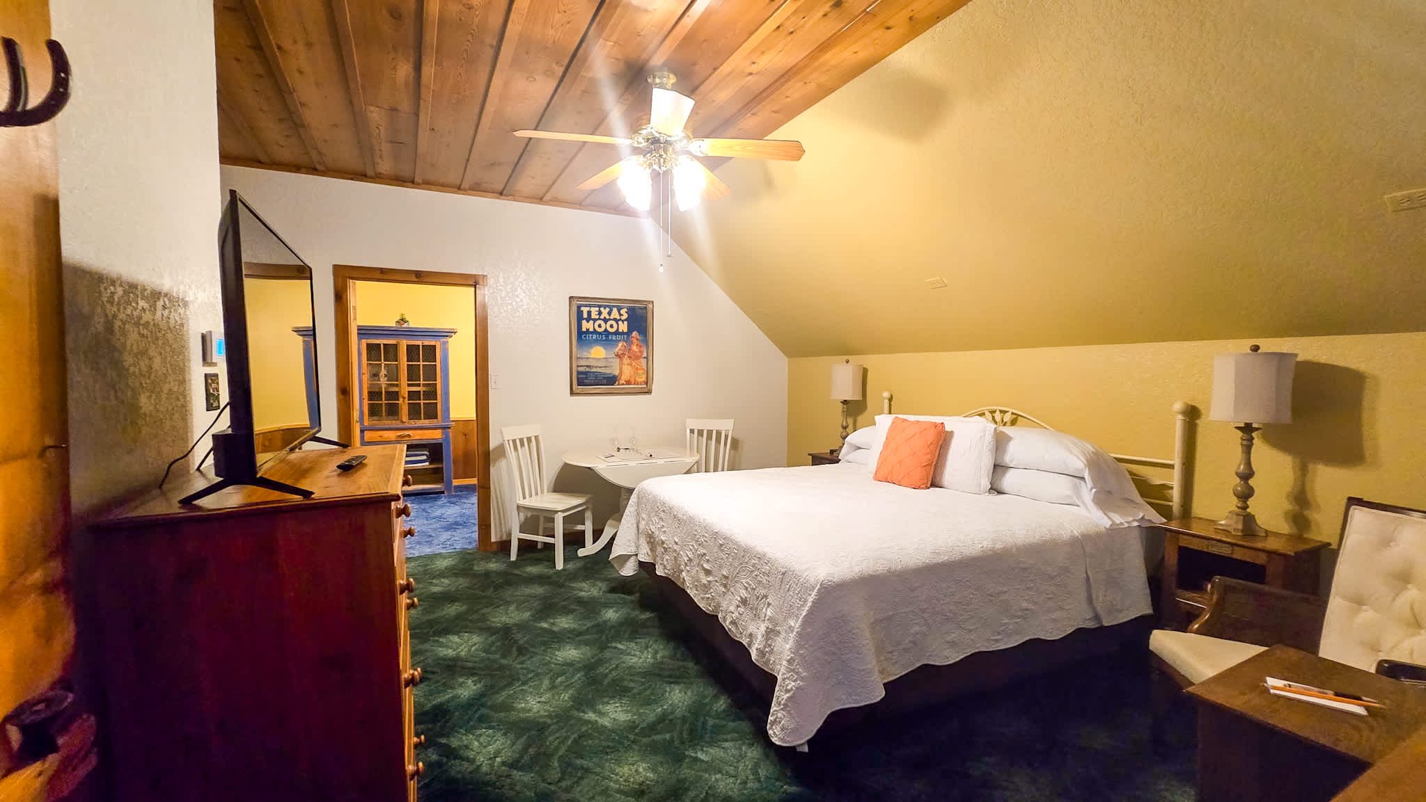 The primary bedroom area offers a king bed & smart TV​