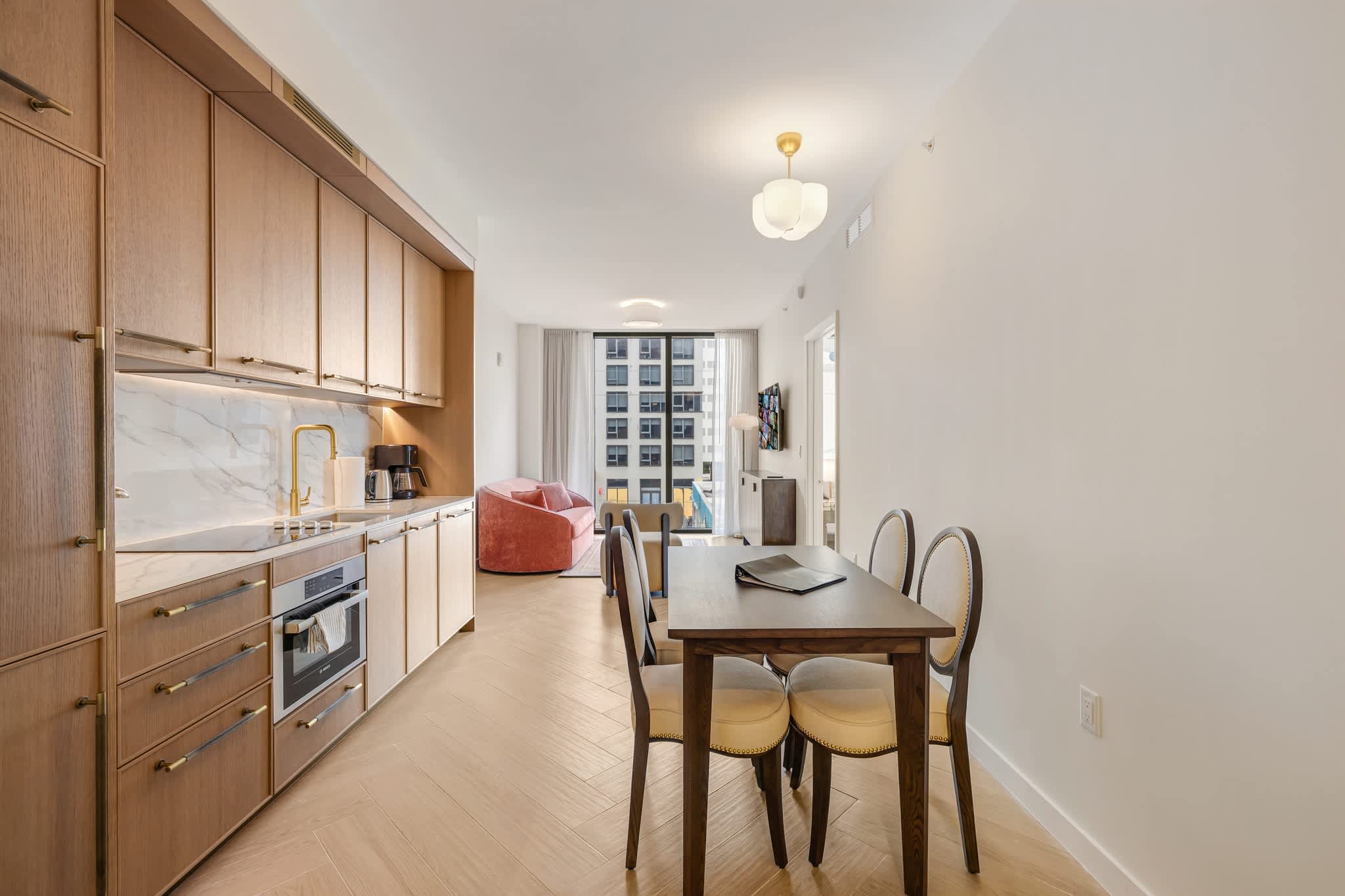 Experience modern living with a sleek kitchen and cozy dining area, perfect for intimate gatherings.
