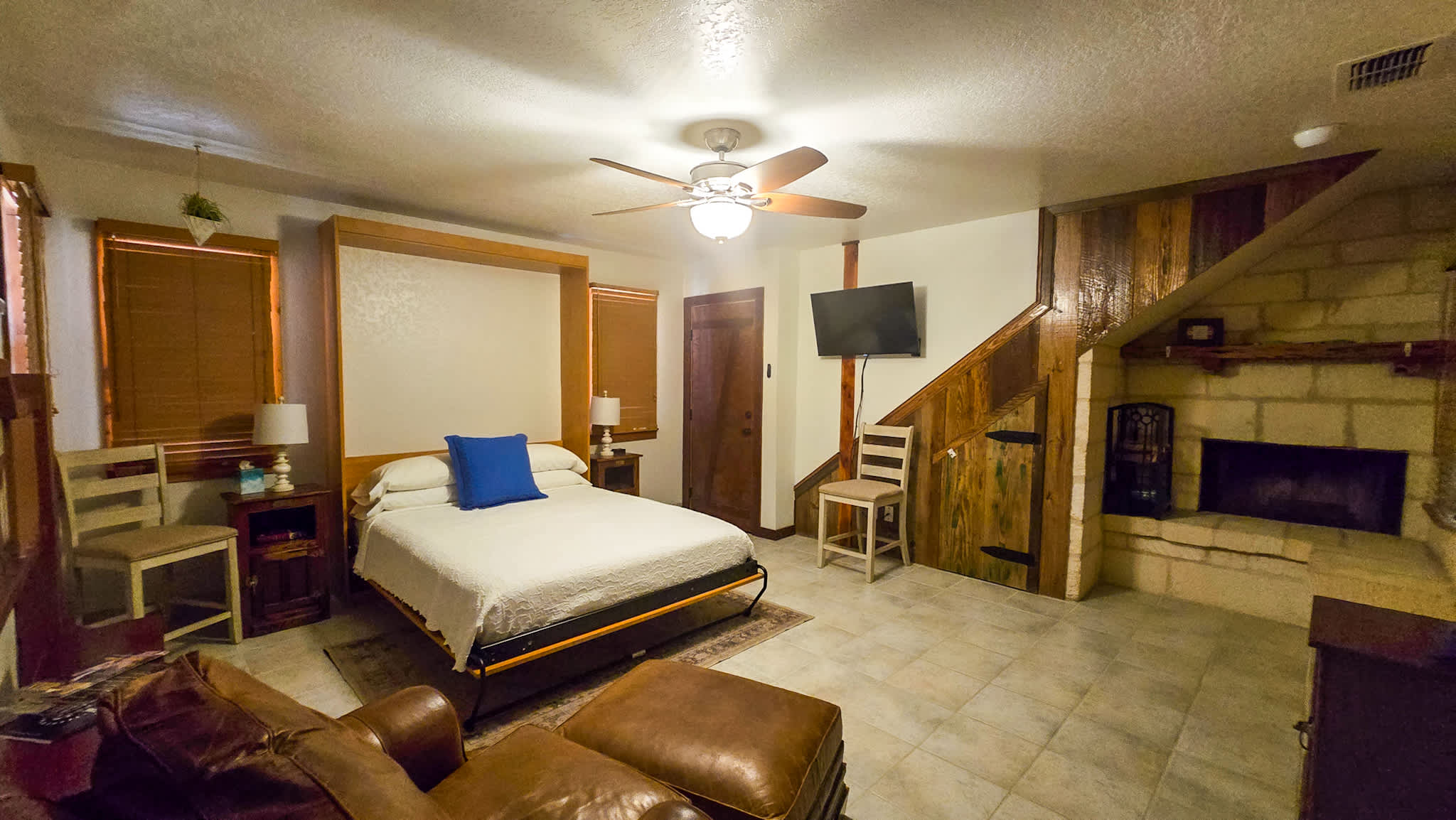 Recharge in Concan’s cozy queen-sized Murphy bed & stream your favorites on the smart TV​