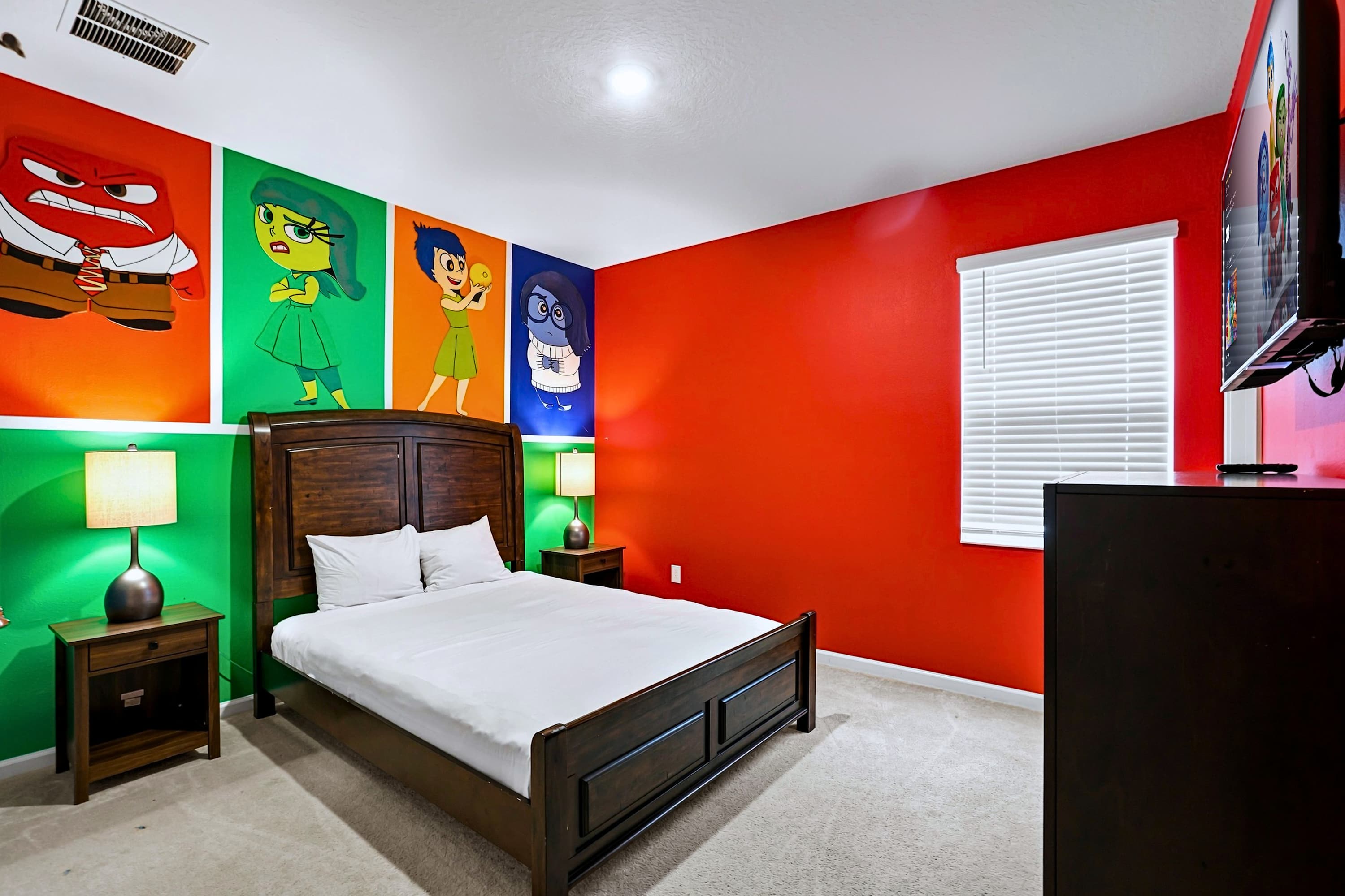 Inside Out themed bedroom featuring a Queen Bed and dual bedside reading lamps
