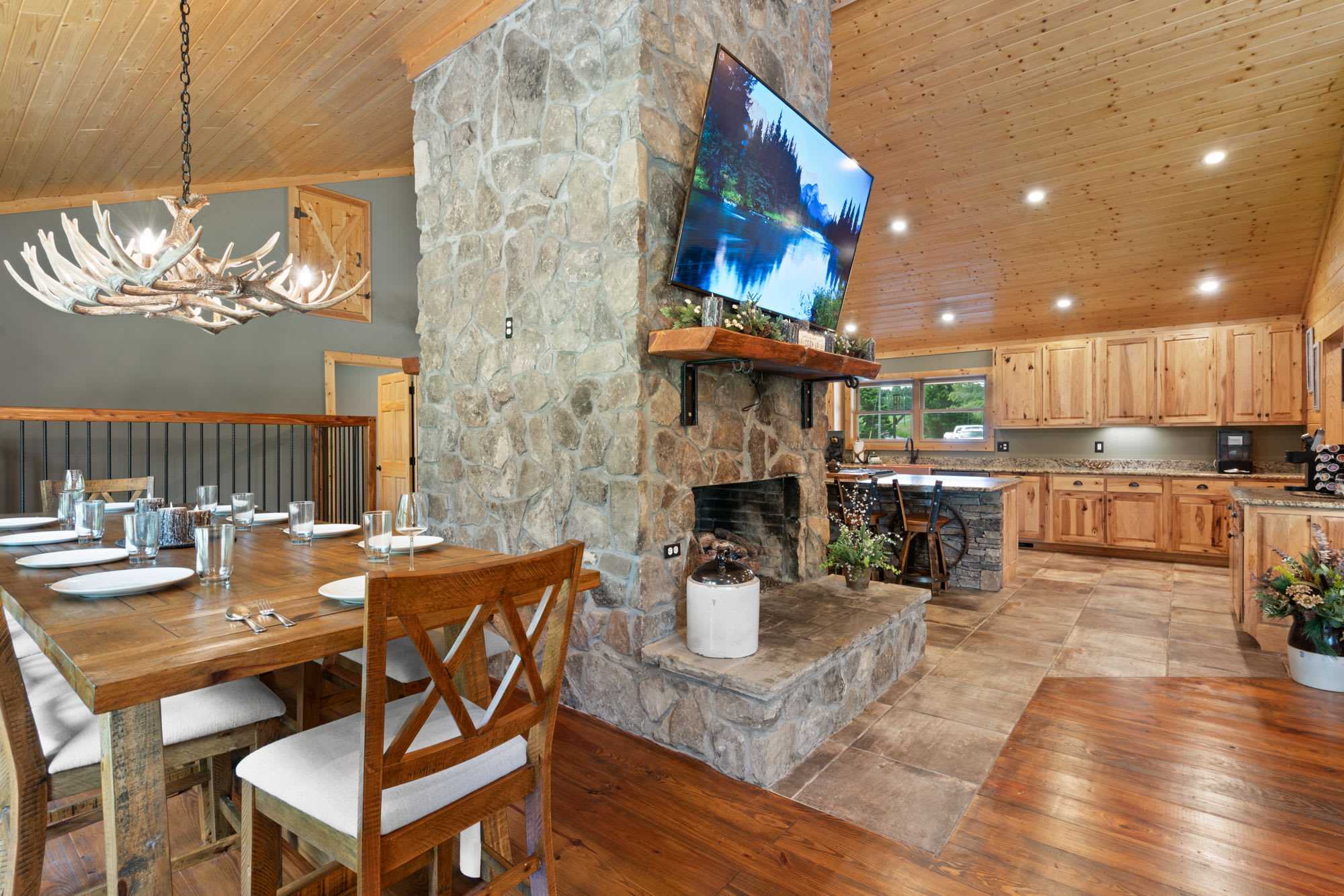 Dinning room, living room fireplace, & kitchen at The Lodge