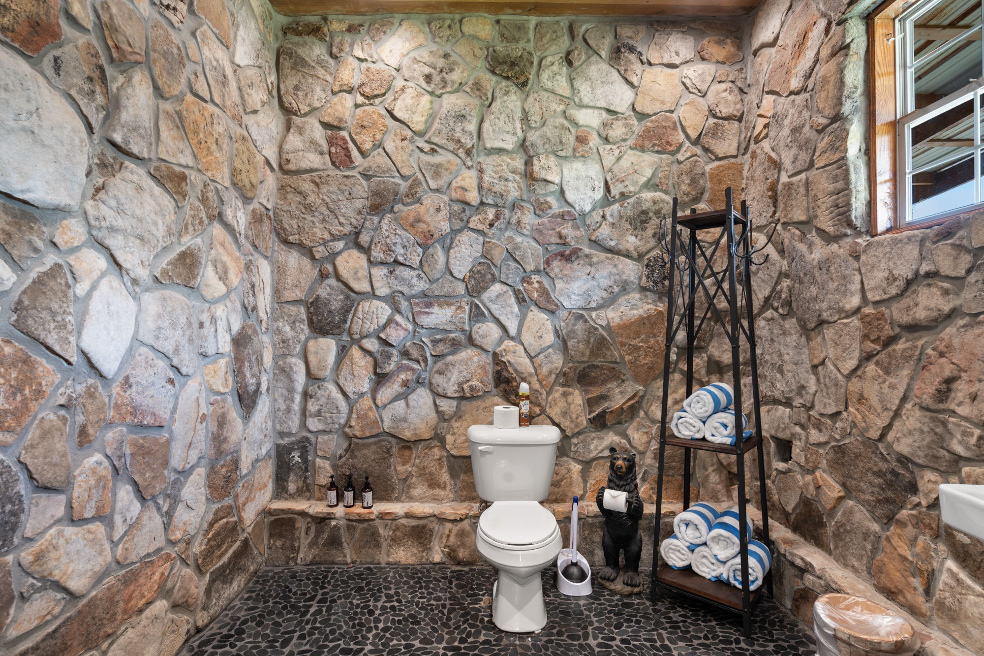 Full bathroom off the entrance which is perfect after a day of swimming!