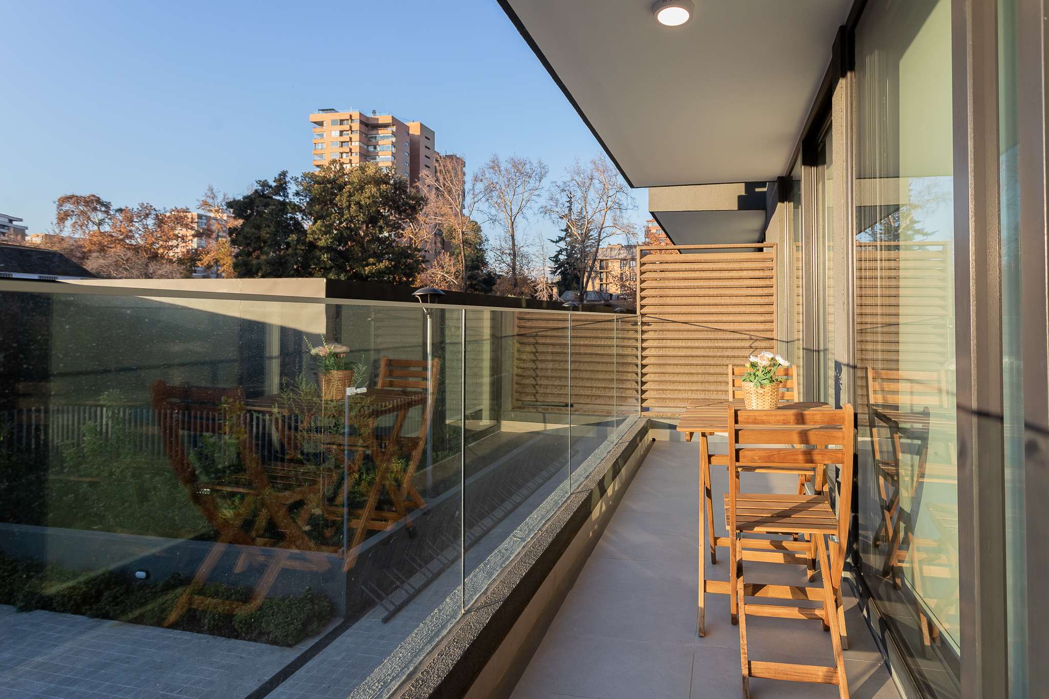 Enjoy morning coffee on your private balcony with serene views of the cityscape and lush greenery.