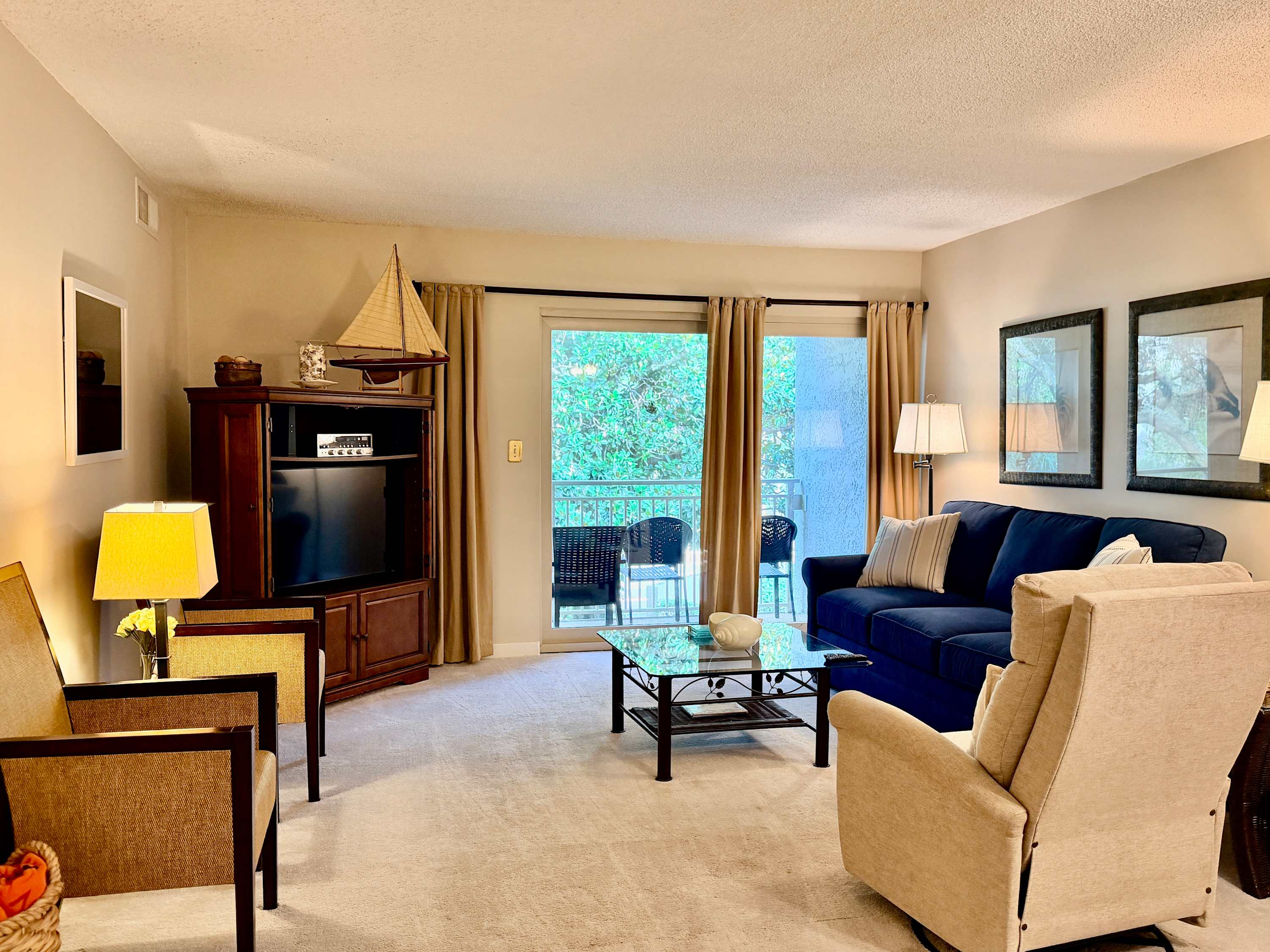 Relax in the spacious Living Room with natural light and comfy sleeper sofa and recliner.