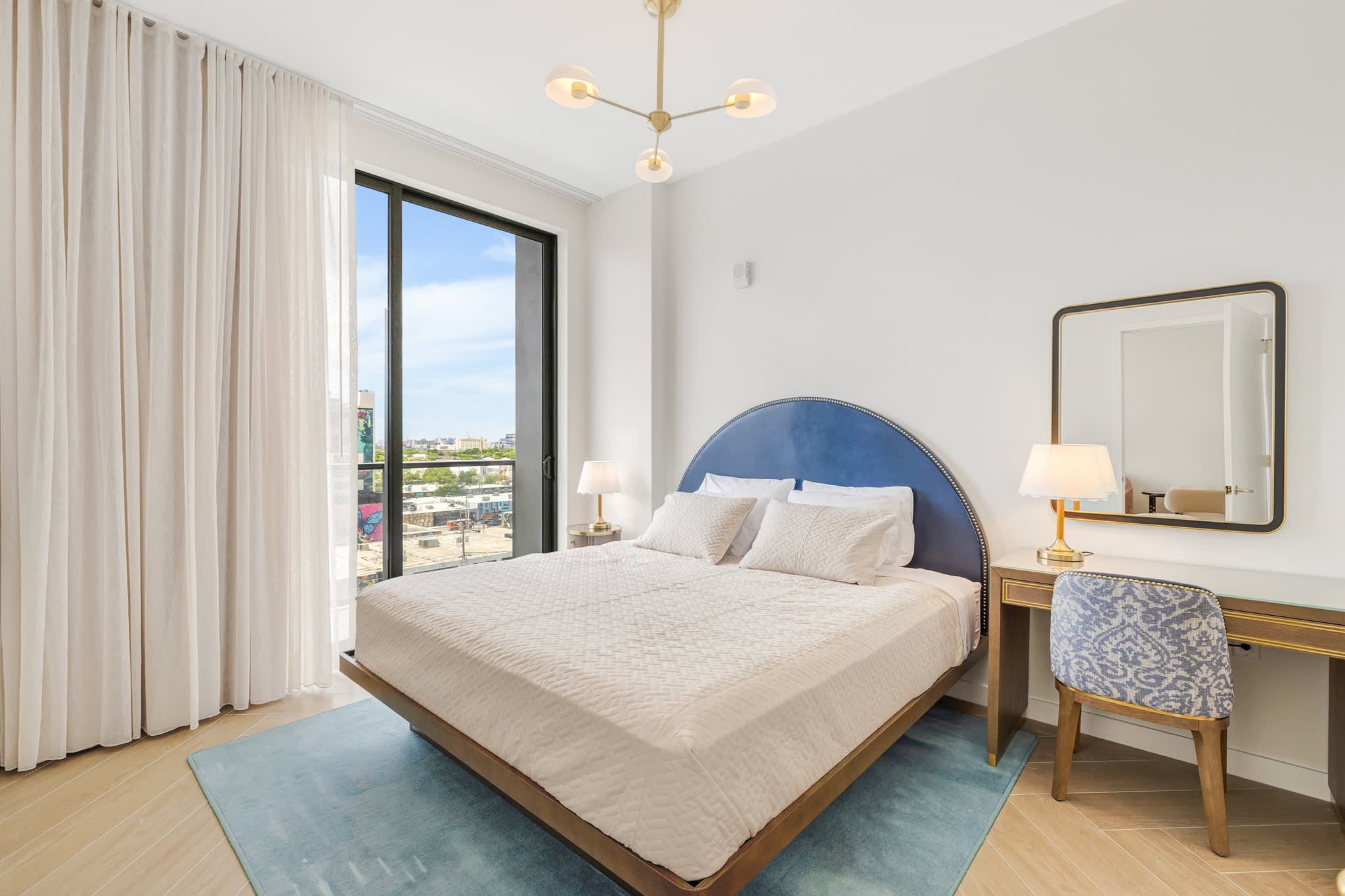 Relax in this bright and stylish bedroom with city views, perfect for unwinding after a day of exploring.