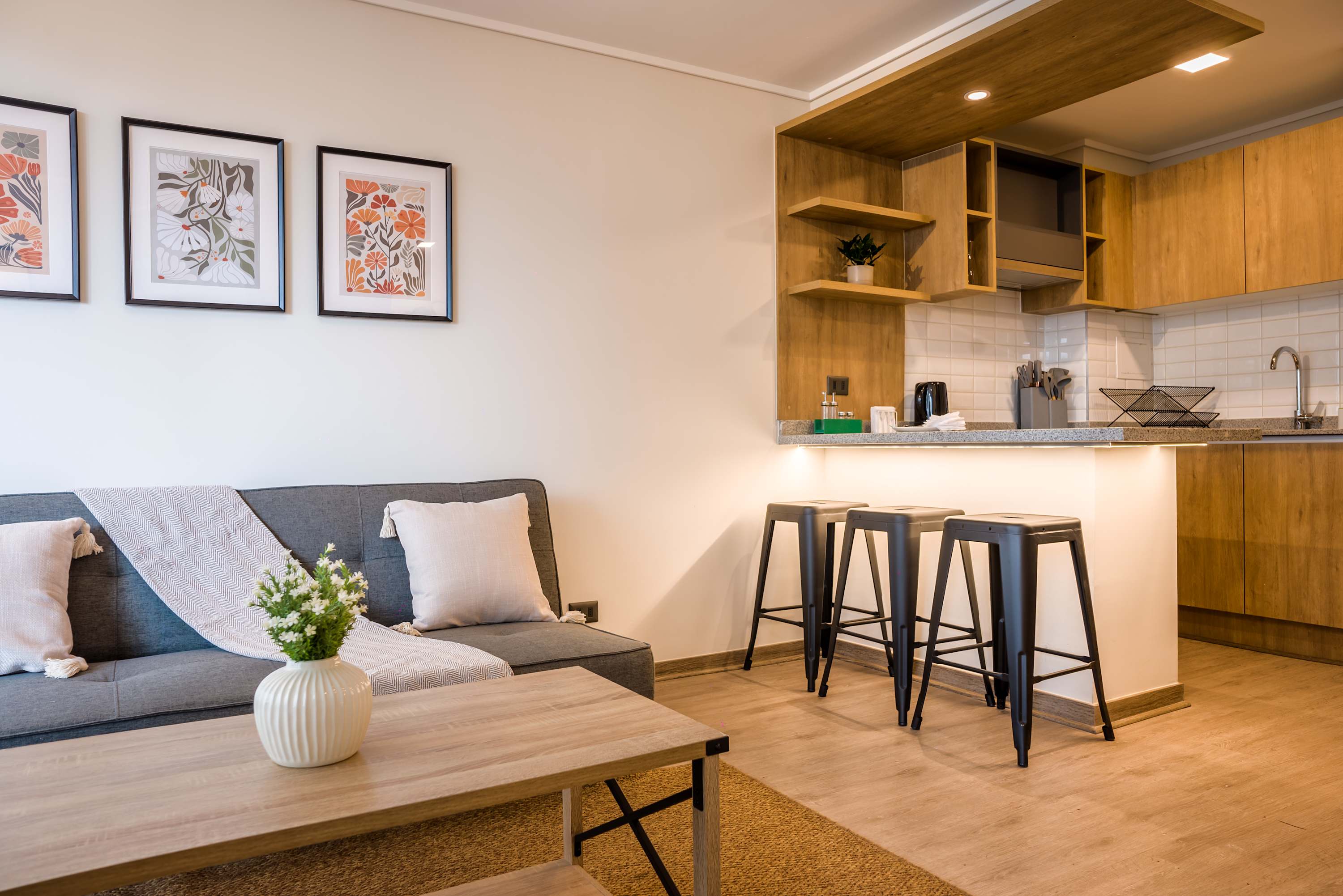 Relax in this stylish studio with a cozy living area and modern kitchen, perfect for a comfortable stay.