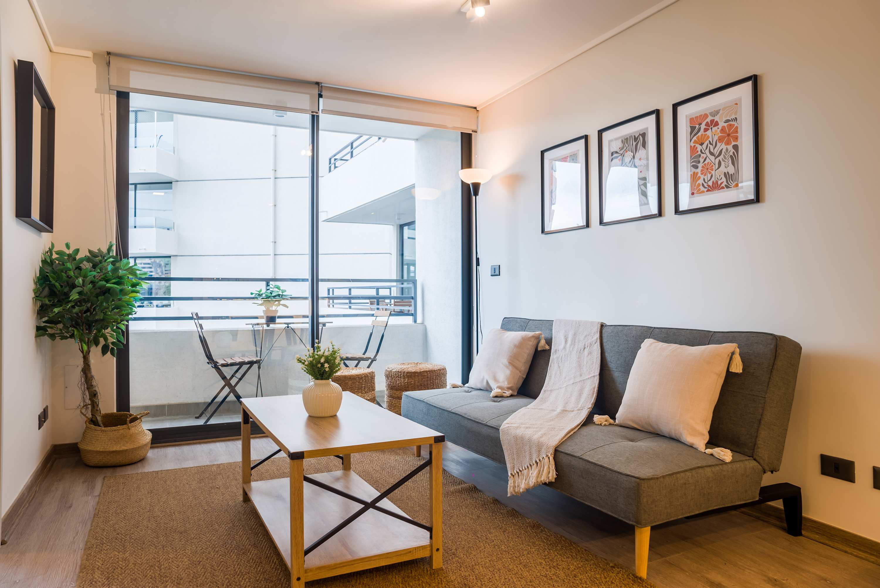Relax in this cozy living space with a balcony view, perfect for enjoying a morning coffee or evening breeze.