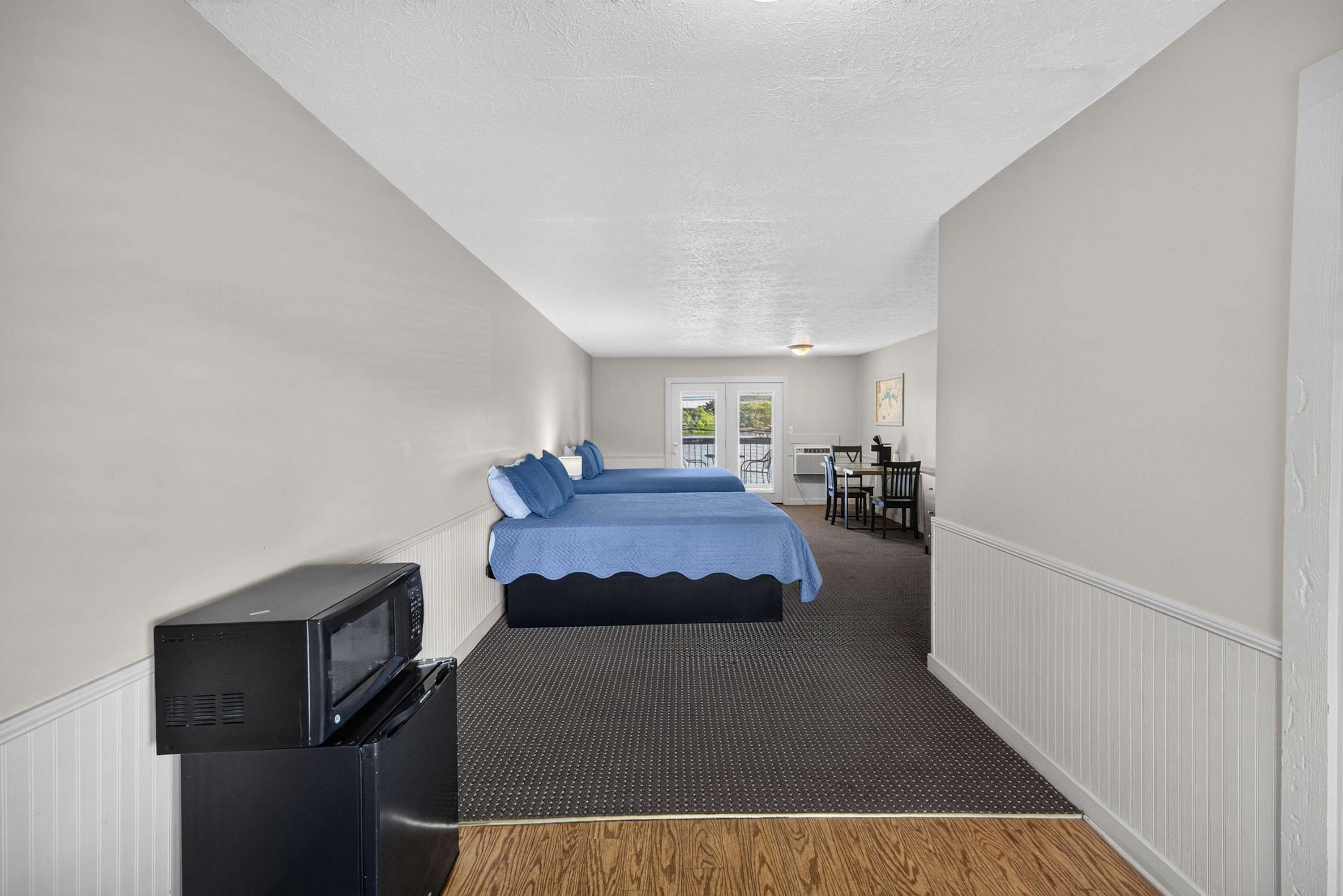 Entrance to your unit with a mini fridge and microwave