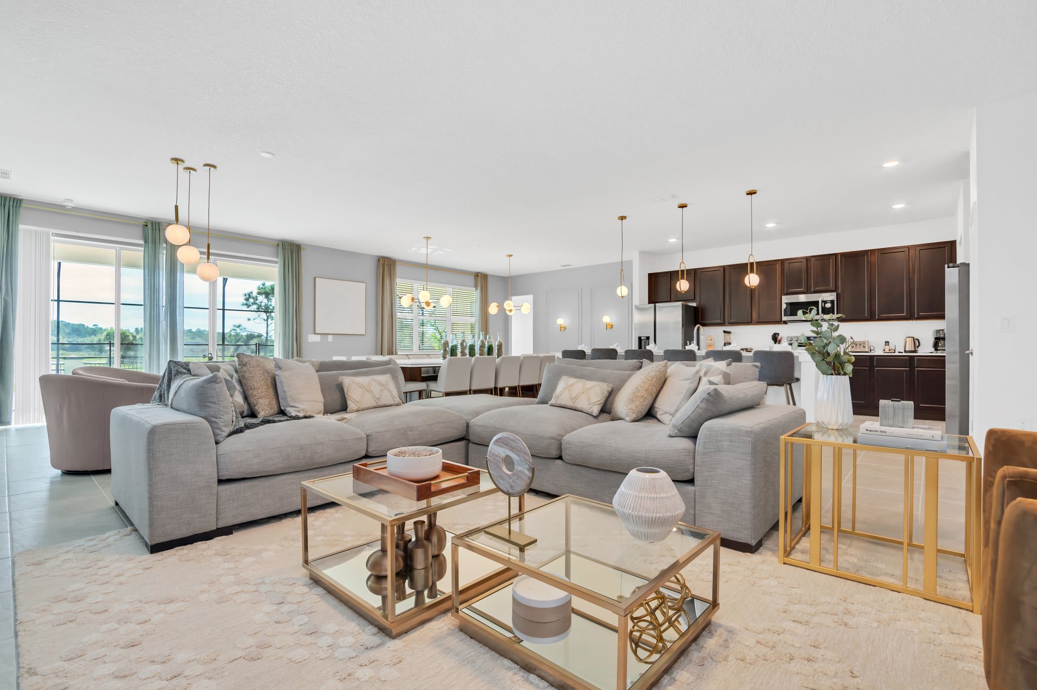 Experience luxury in this expansive living area with modern decor and ample seating, perfect for large gatherings.