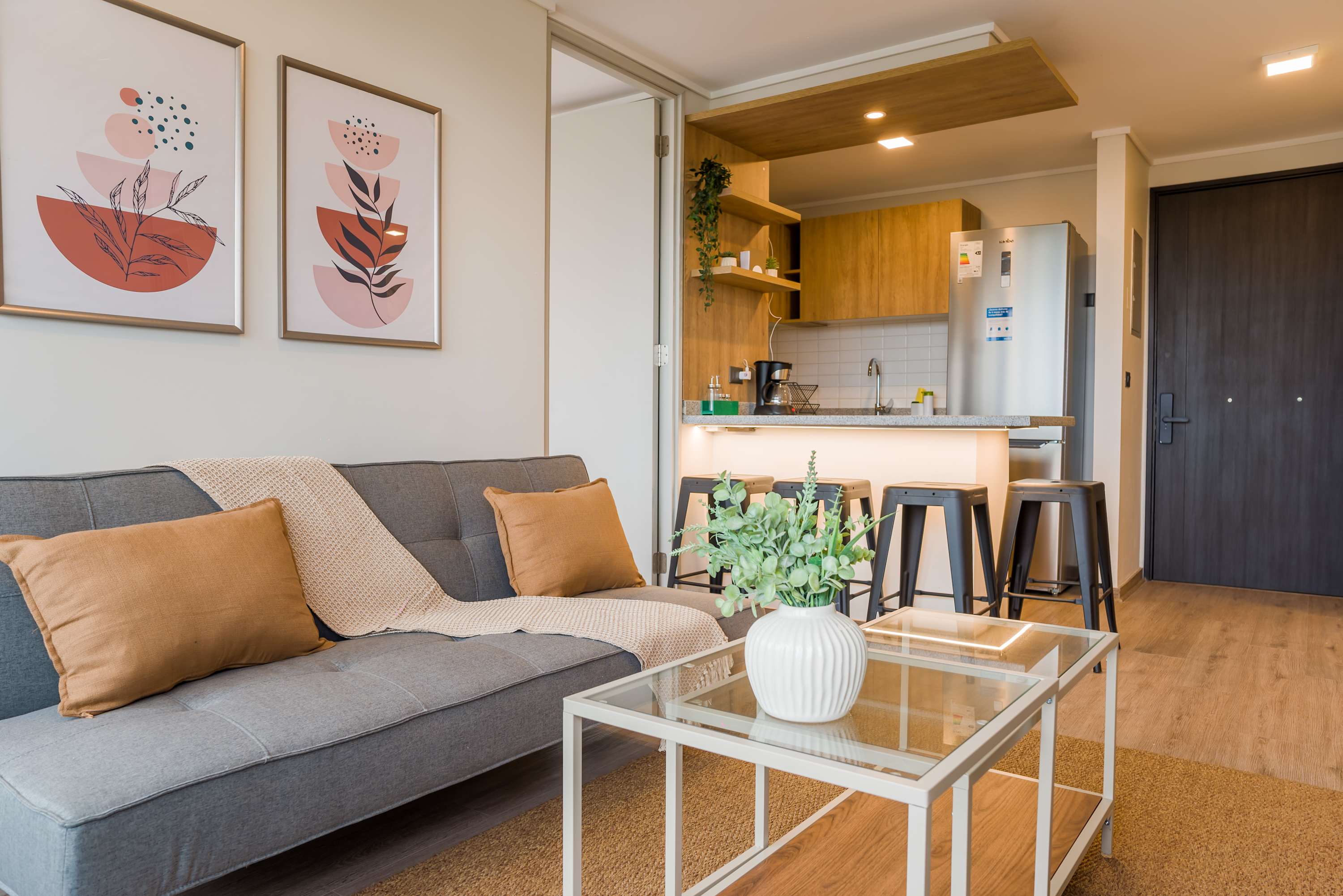 Charming living space with modern decor and a cozy kitchen area, perfect for relaxing after exploring the city.