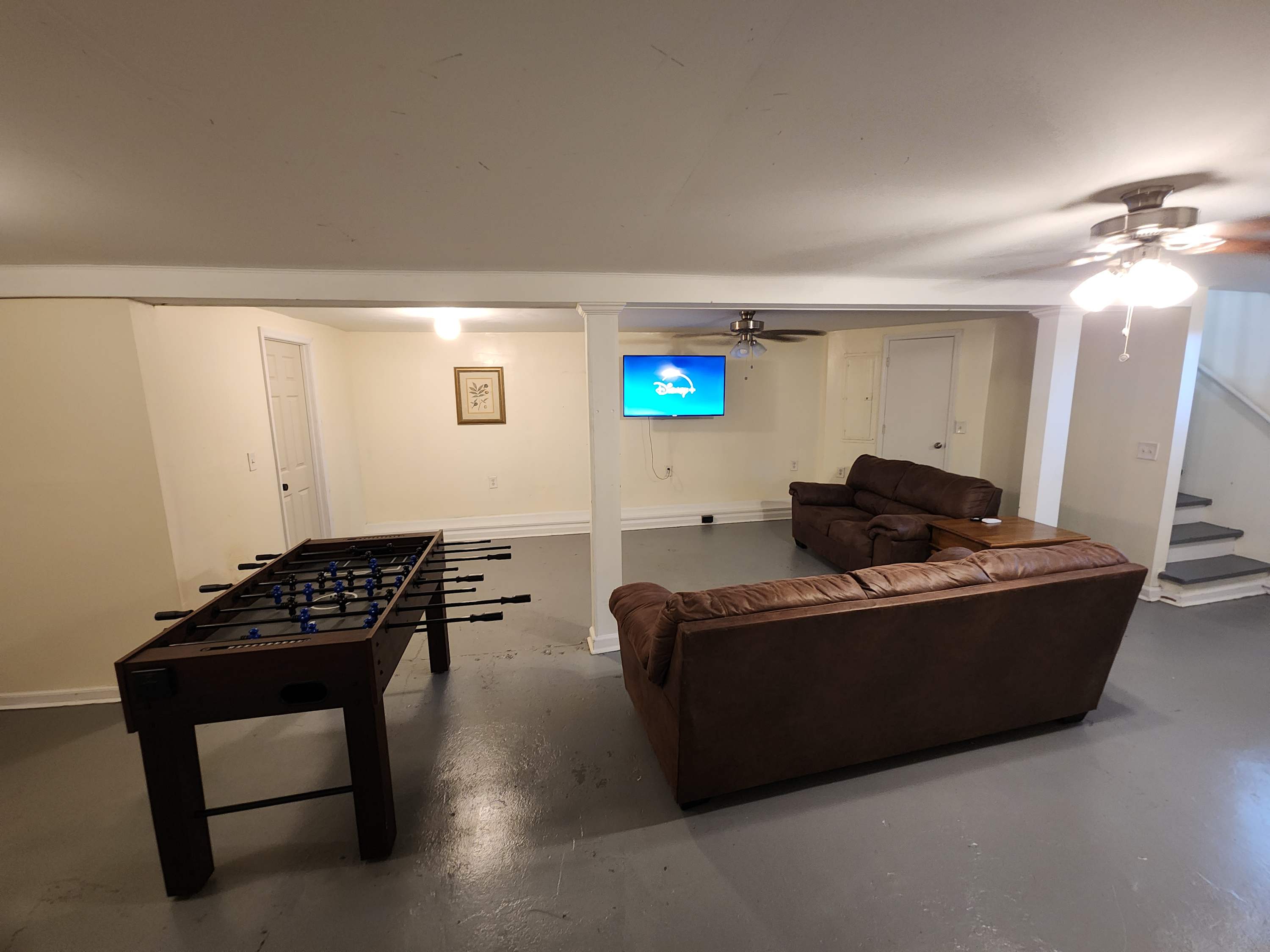 Foosball Table. TV  & 2 Couches in Basement