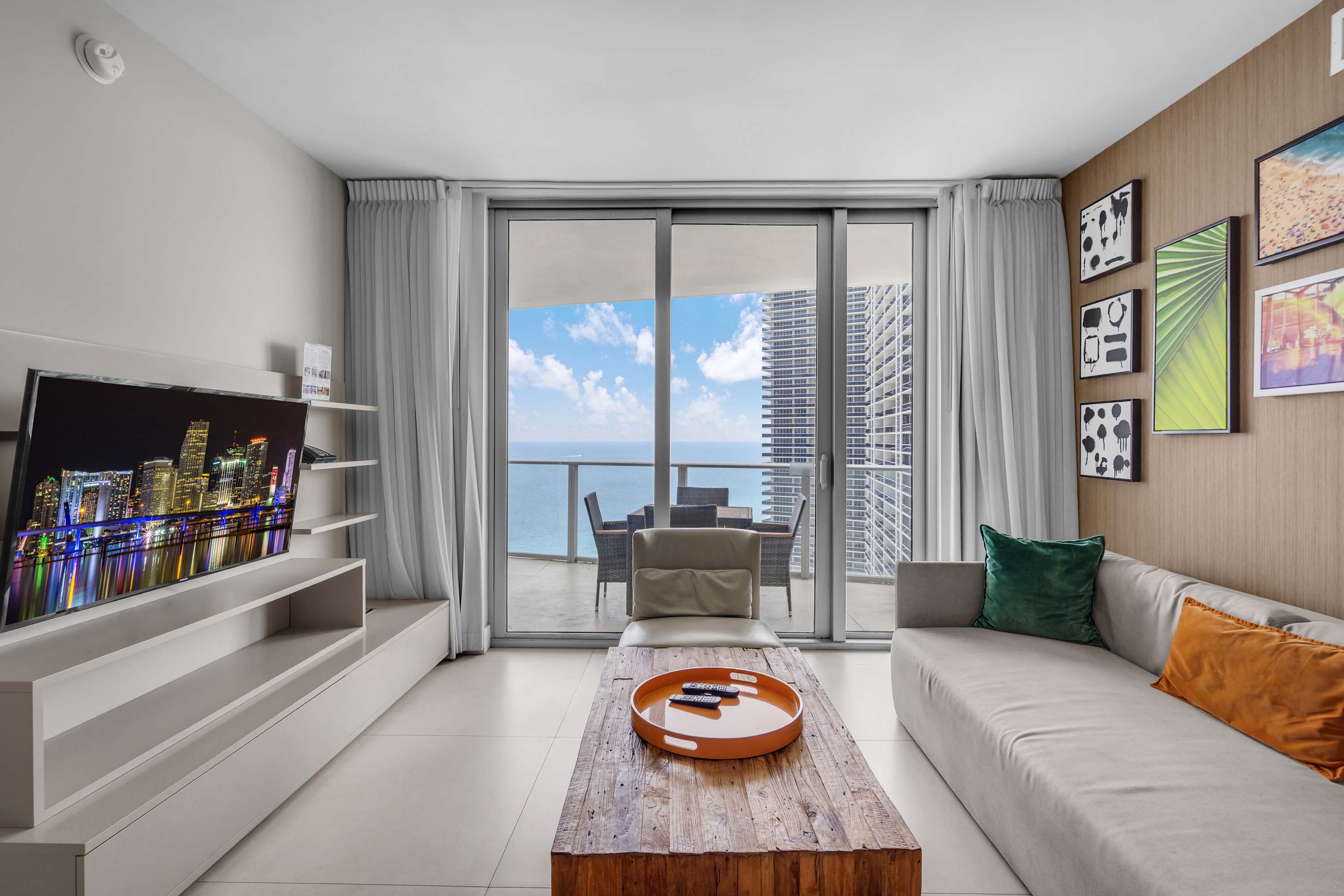 Unwind in the breezy living room & stream your favorites on the smart TV​