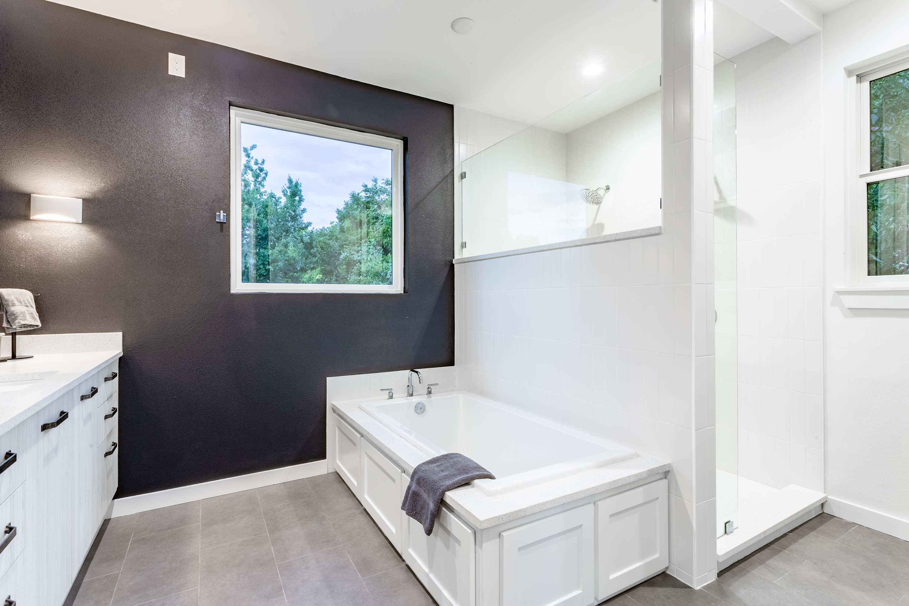 Spacious Bathroom with Double Sink and Soaking Tub