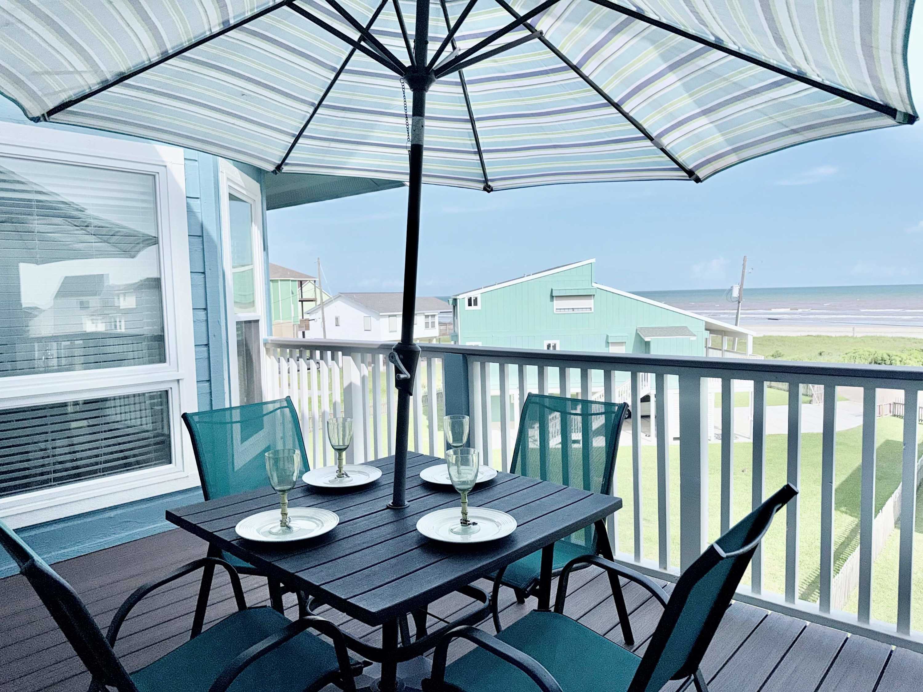 Share memorable meals and relaxation on this patio space while enjoying the ocean views.