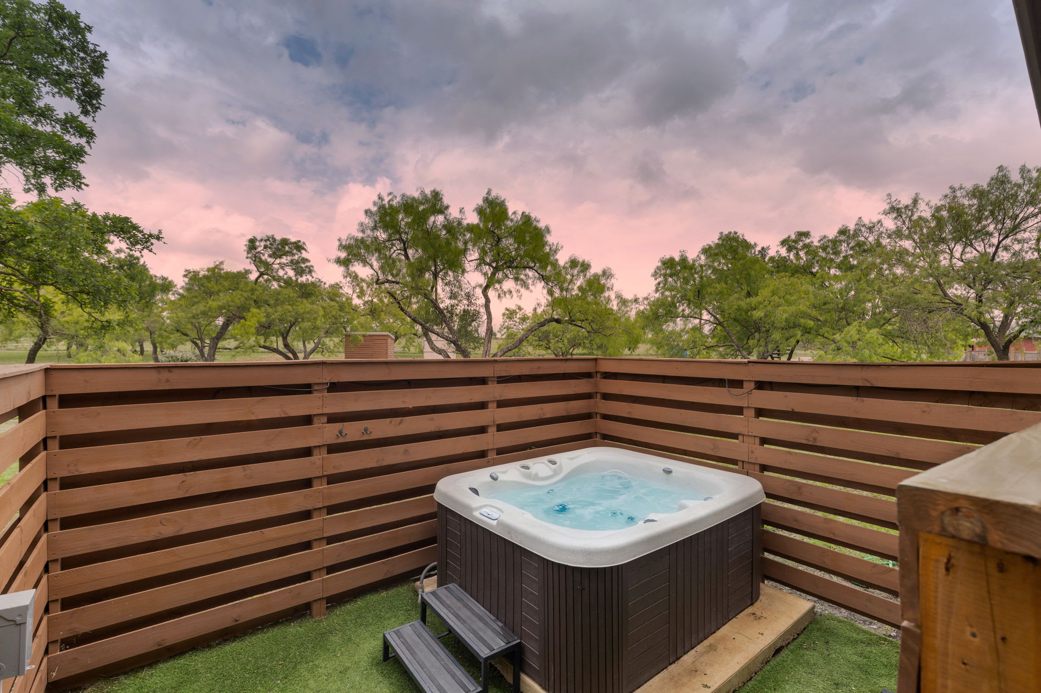 Enjoy an evening soak in the private hot tub.