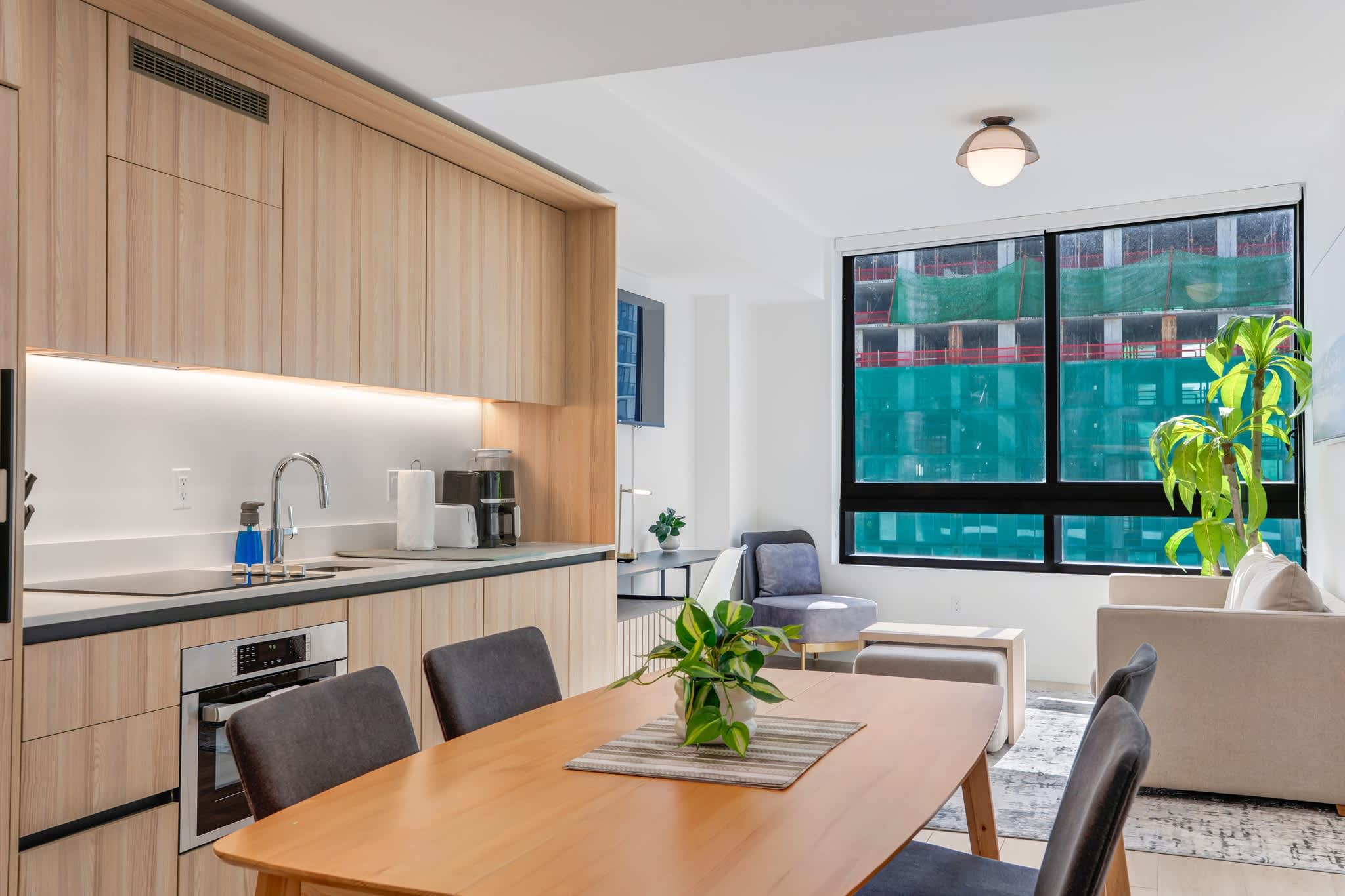Bright and modern studio with open kitchen and cozy living area, perfect for a relaxing stay.