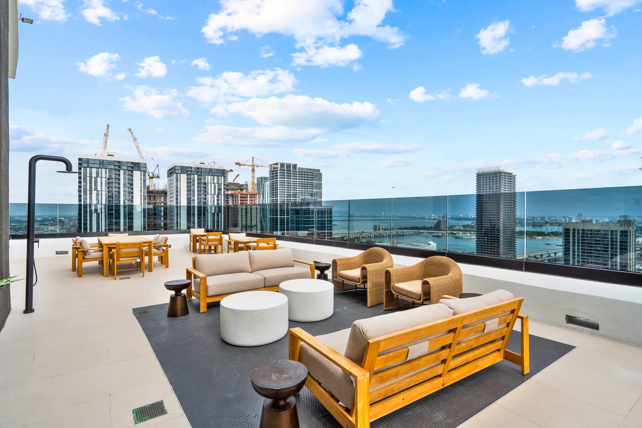 Enjoy breathtaking city and water views from this stylish rooftop terrace, perfect for relaxation and socializing.