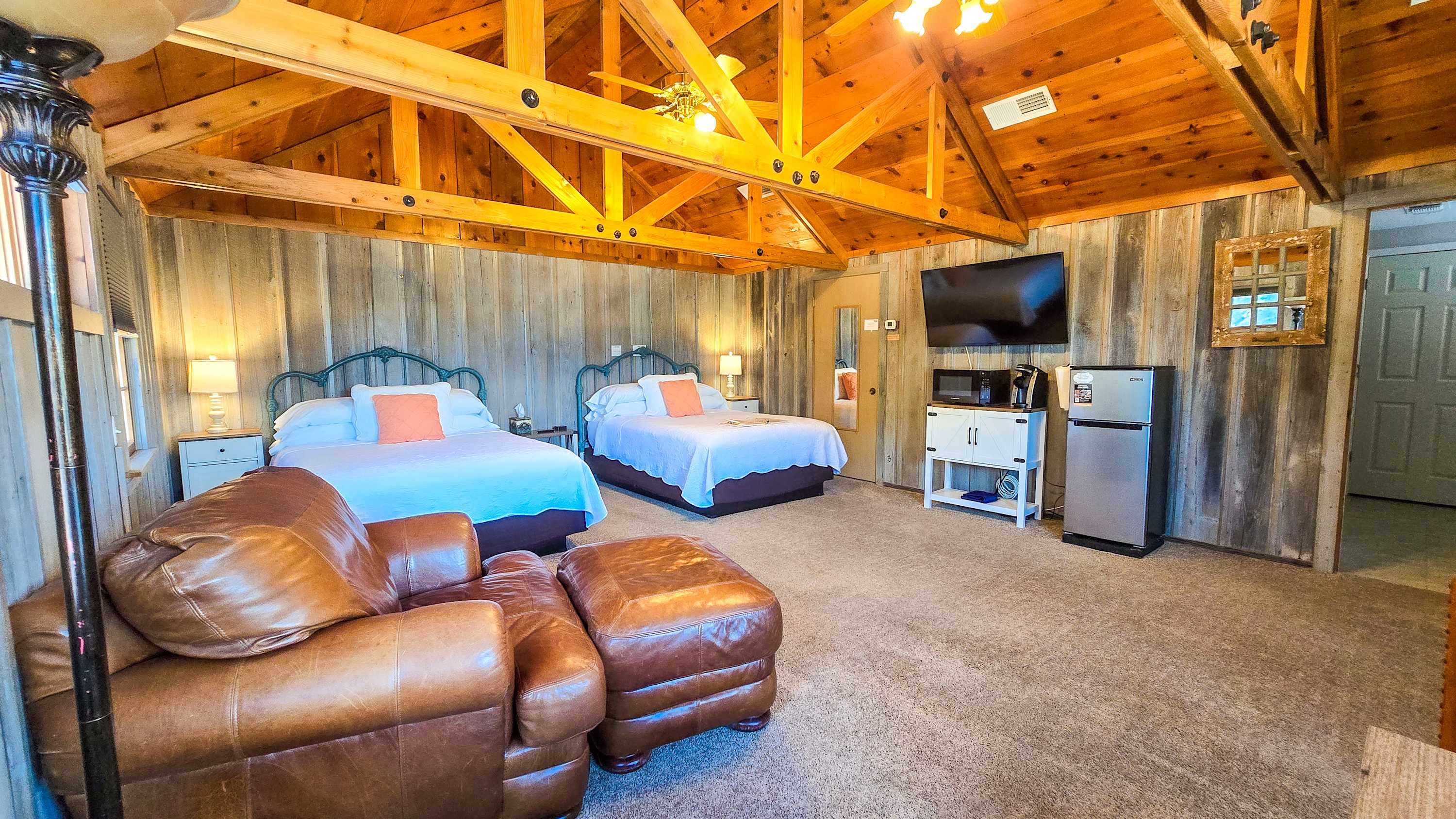 This spacious studio boasts a pair of queen beds, smart TV, coffee bar, & full bath​
