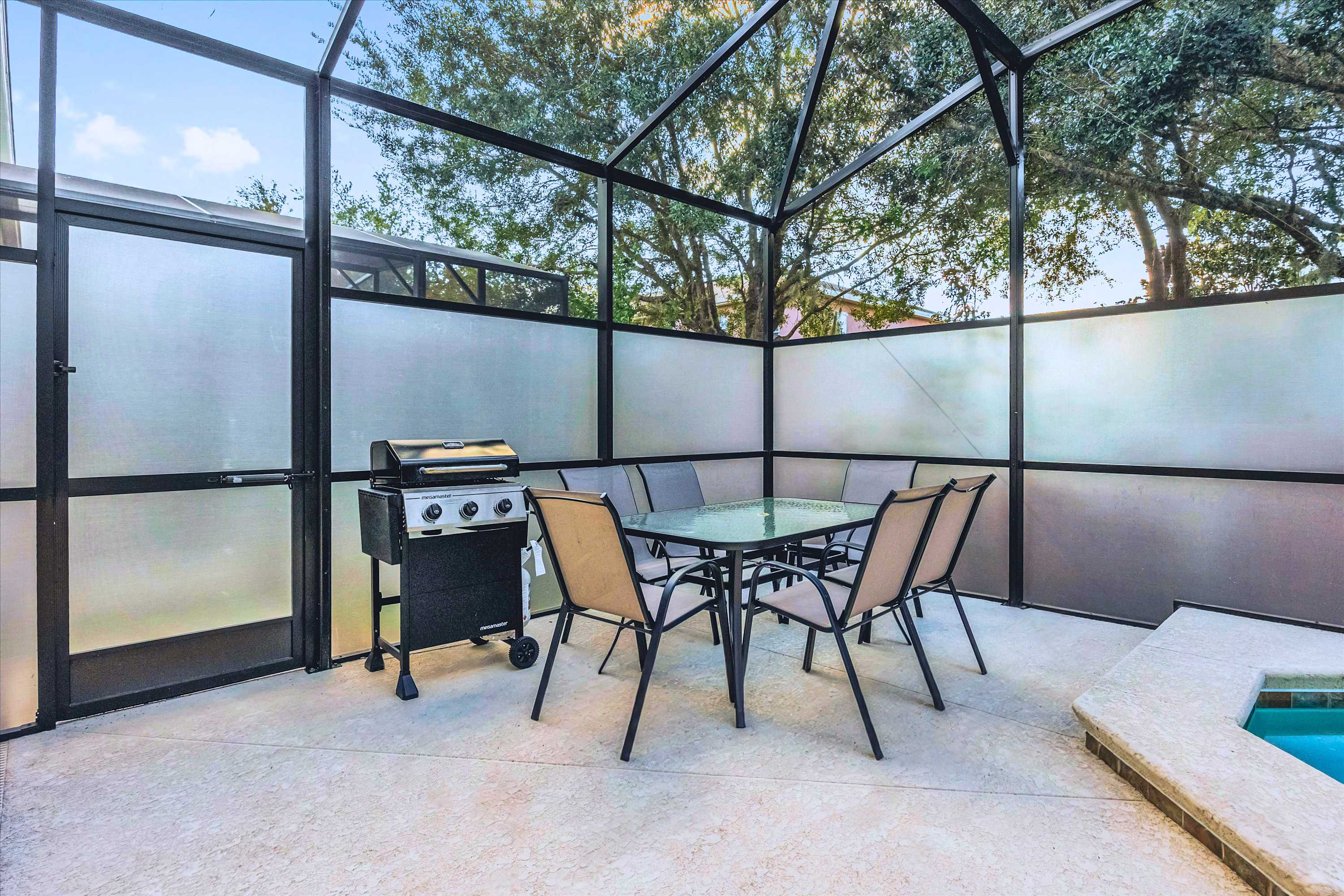 Outdoor Dining Area – Enjoy alfresco meals by the pool with shaded seating and a BBQ grill.