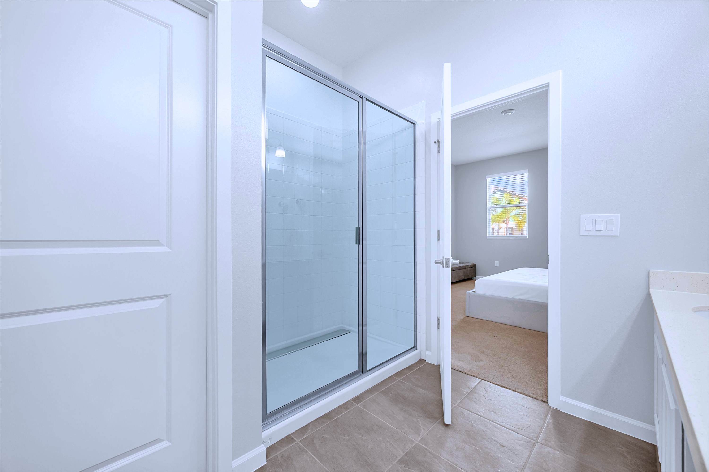 En-suite bathroom setup with a spacious walk-in shower and double vanity