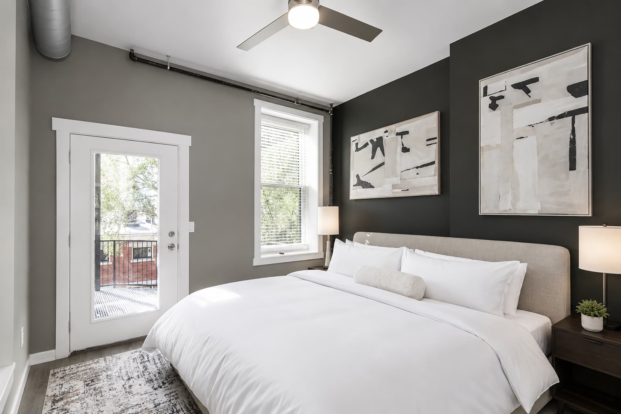 The final bedroom offers a plush king bed as well as balcony & laundry access