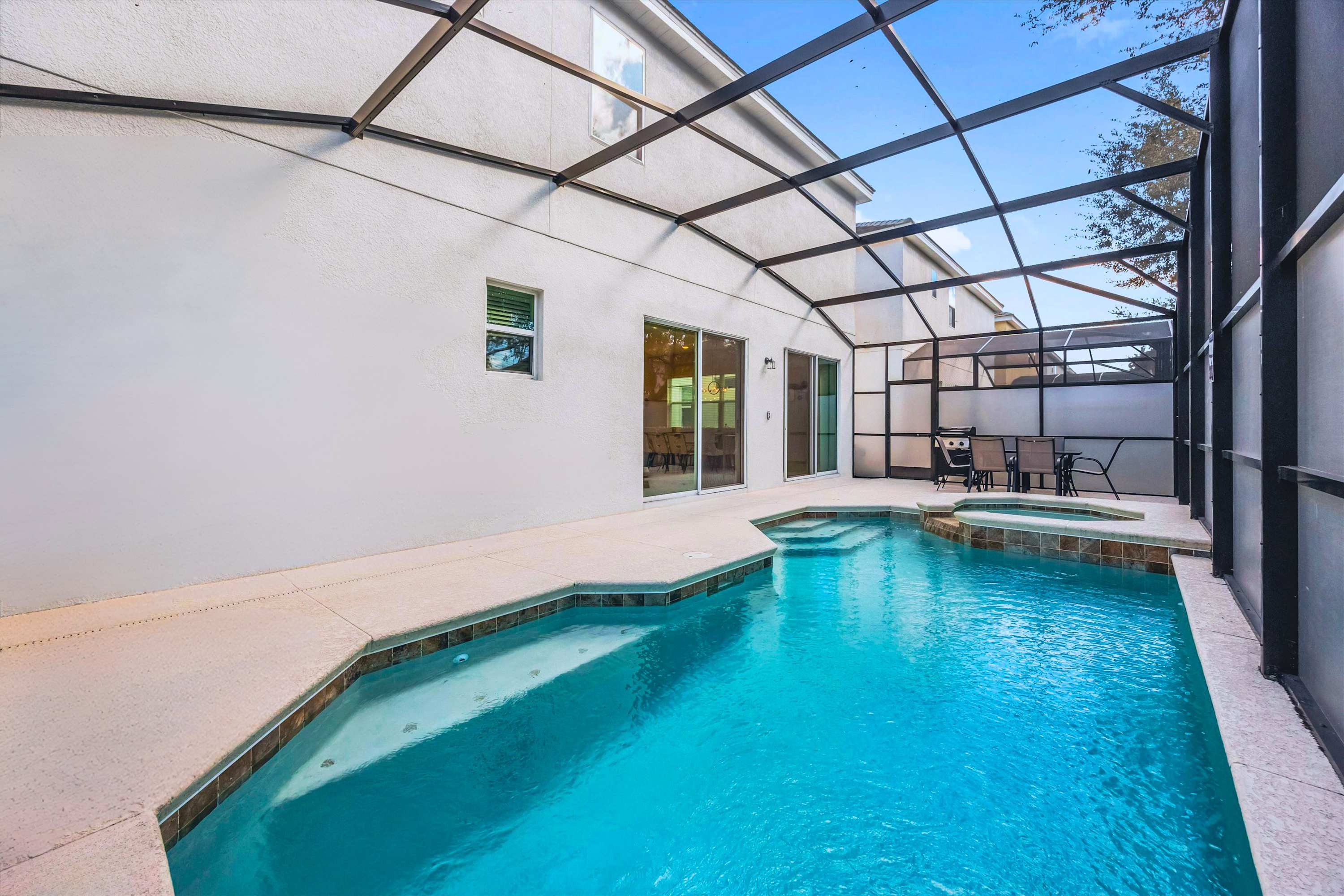 Private Screened Pool with Hot Tub – Relax in your own private pool and hot tub under a screened lanai.