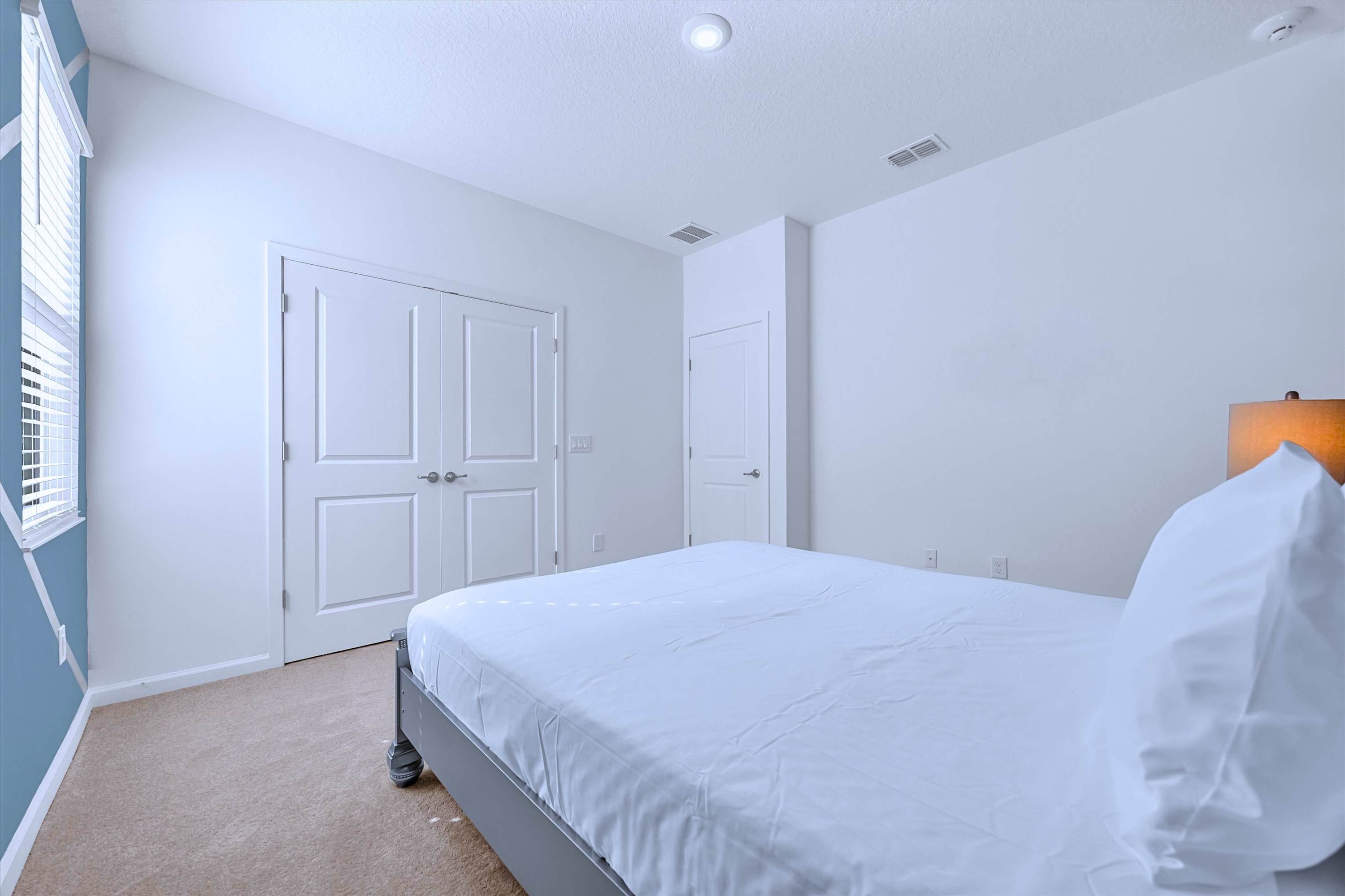 Blue themed Queen suite with premium bedding and a private en-suite bathroom