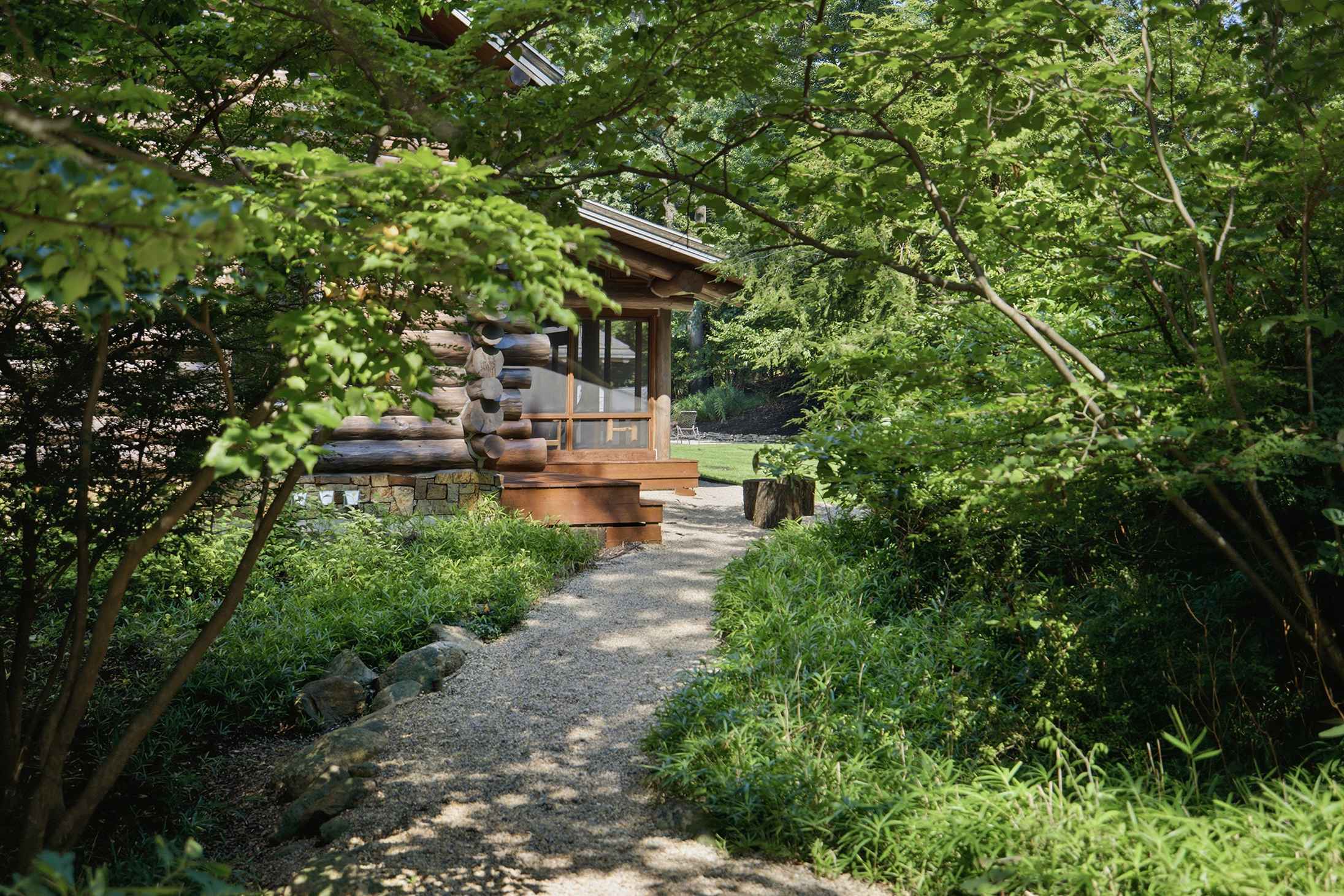 Arrive through lush woodland gardens leading to your private retreat.
