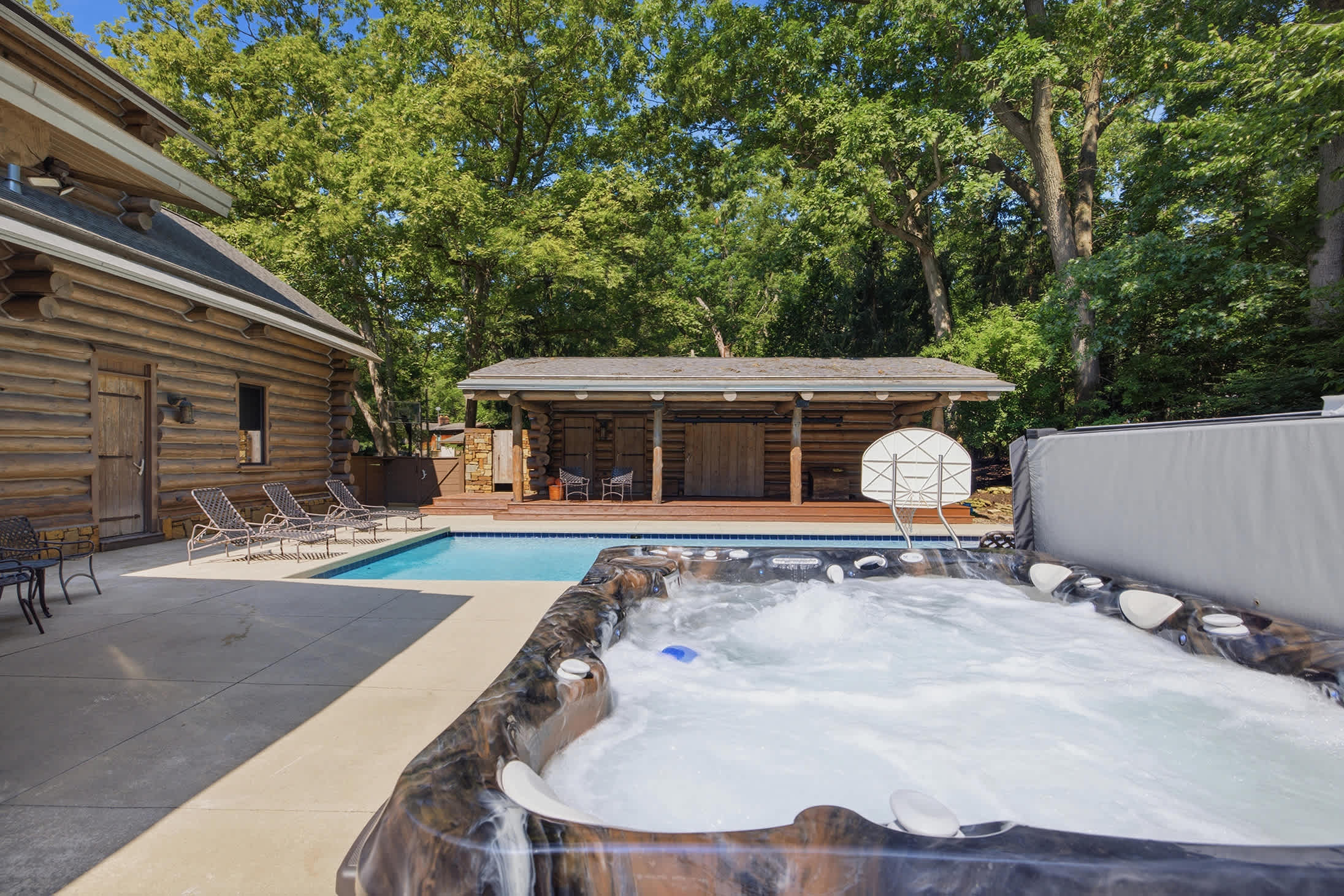 Dip into warm soak in the hot tub, surrounded by the beauty of the woods.