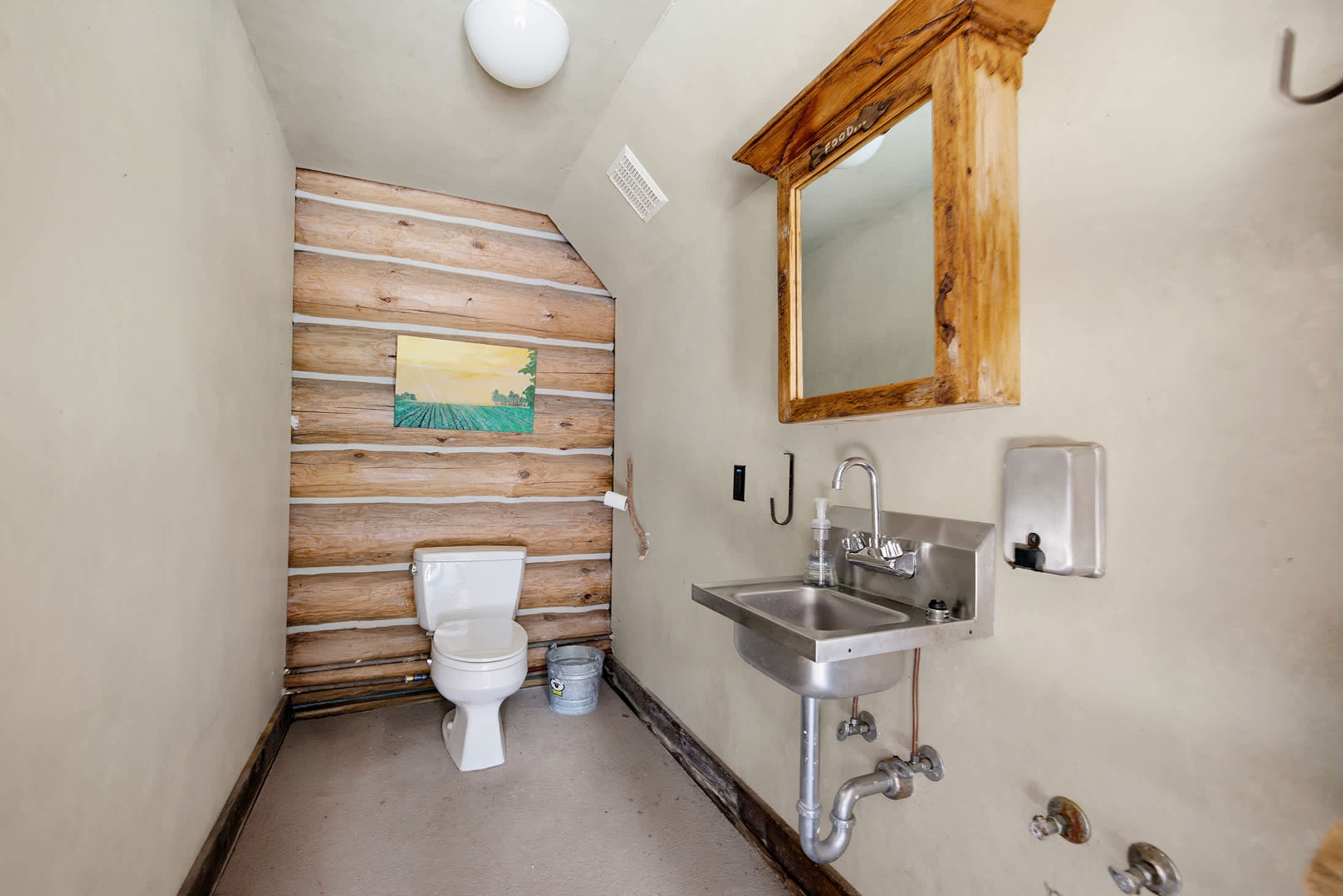 Poolside half bath offers convenient access without heading inside.