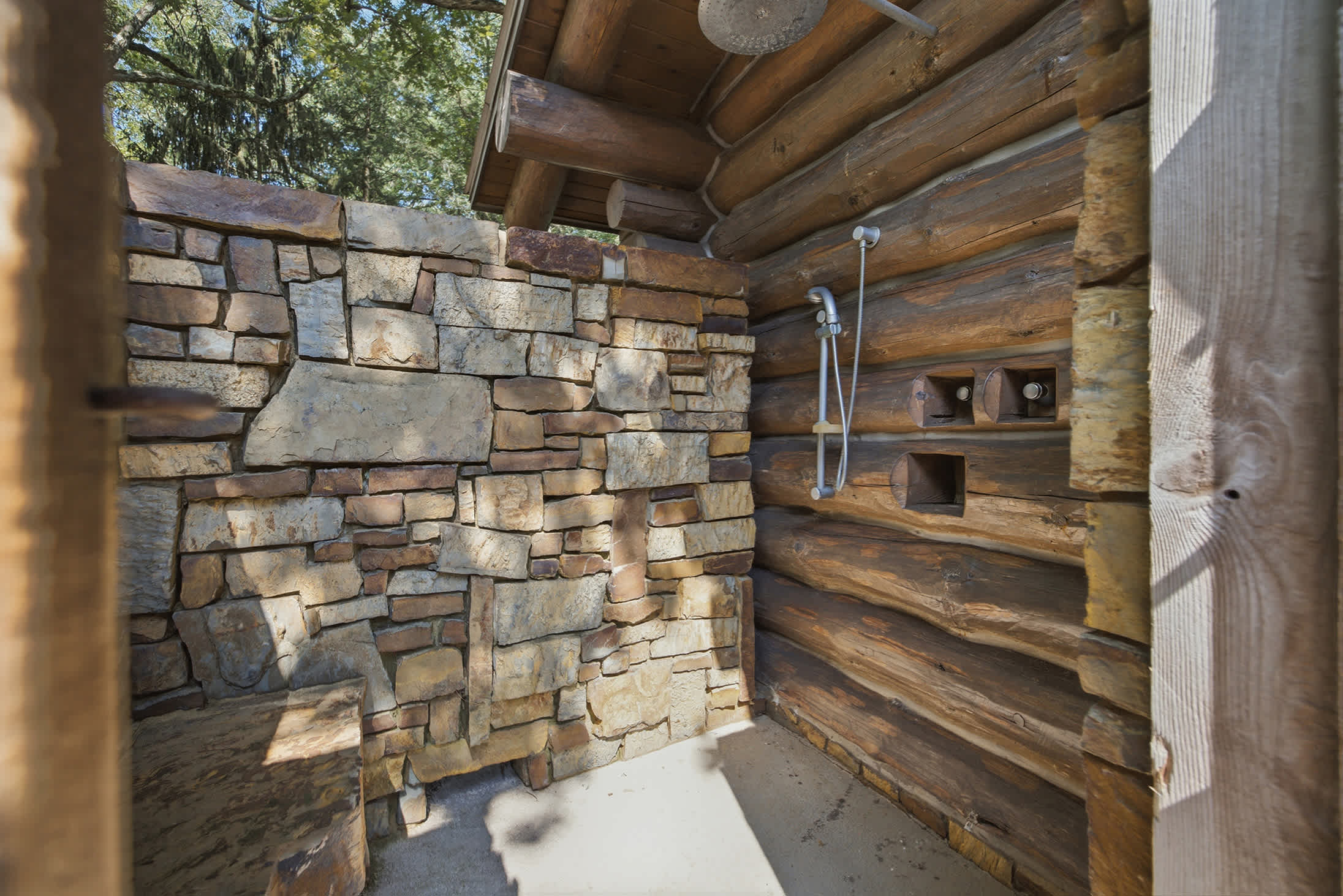 Rinse off under the trees with warm stone and fresh air.