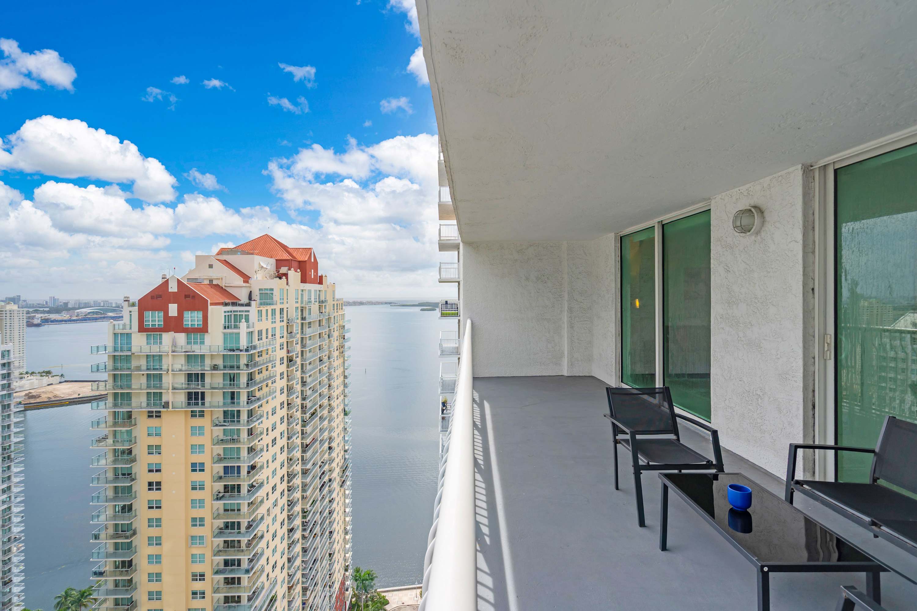 Sip morning coffee or an evening cocktail on the balcony with city & water views​