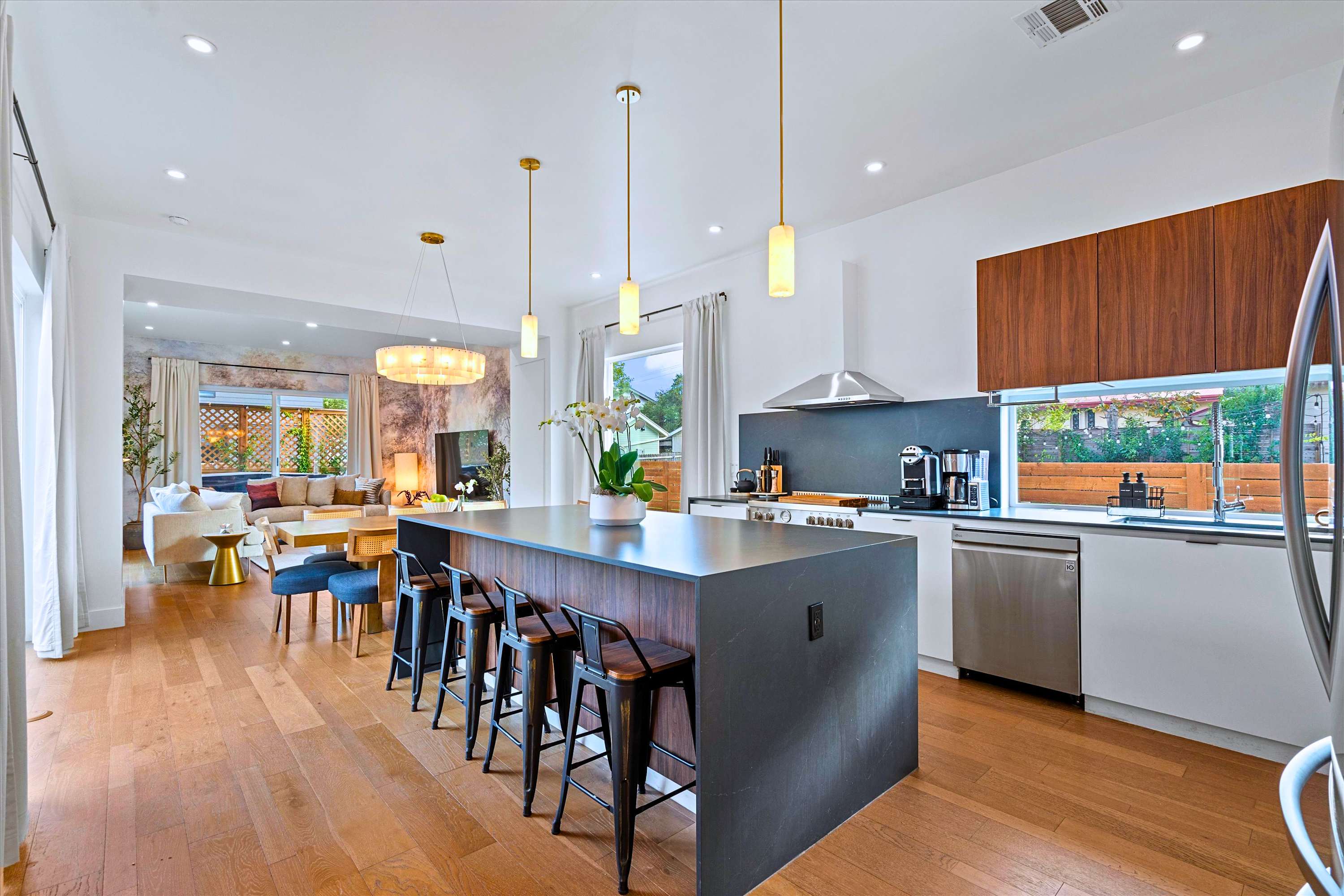 Morning coffee at the island: bright, airy kitchen made to gather
