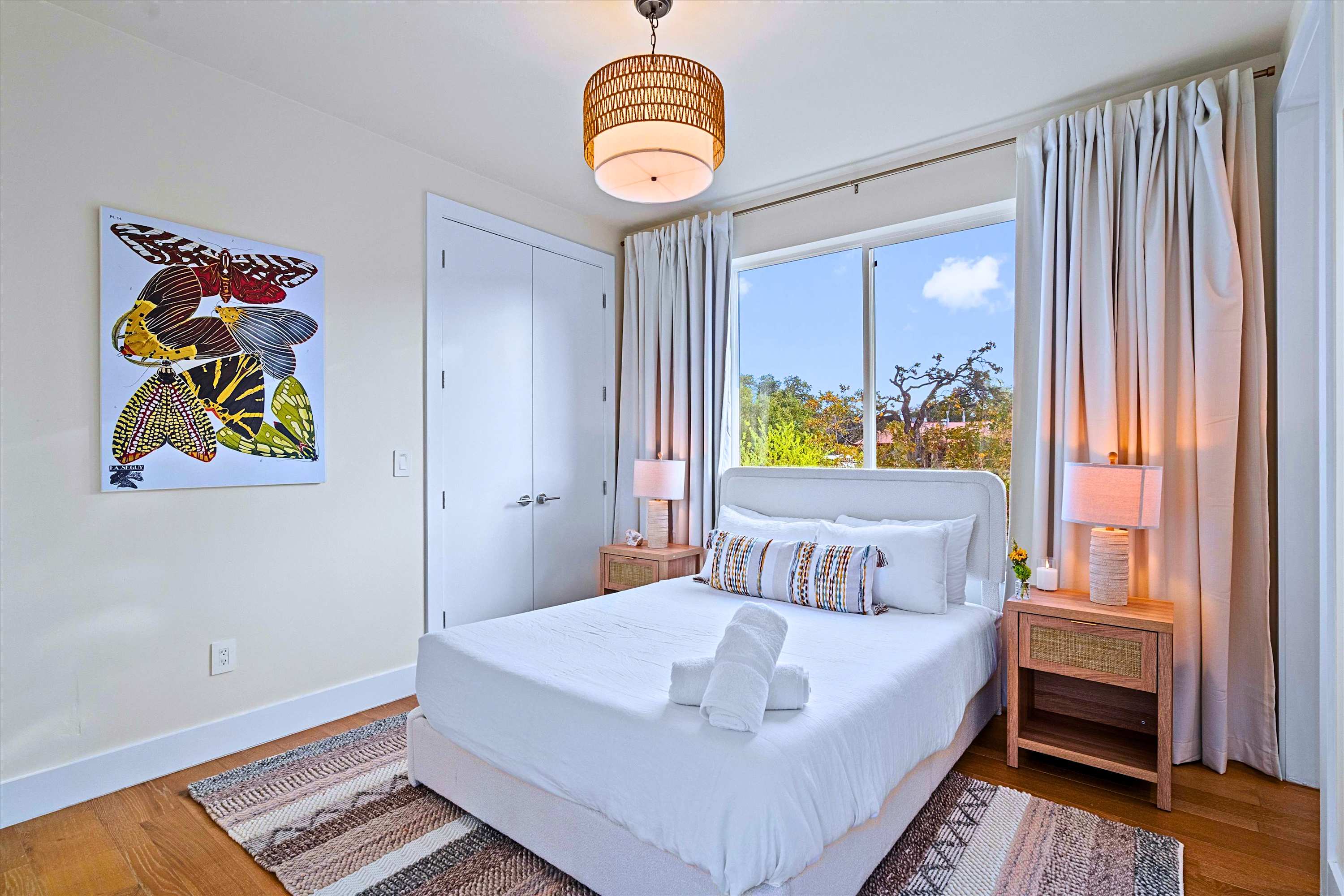 Cozy Queen Bedroom with Warm Accent Lighting and Soft Linens