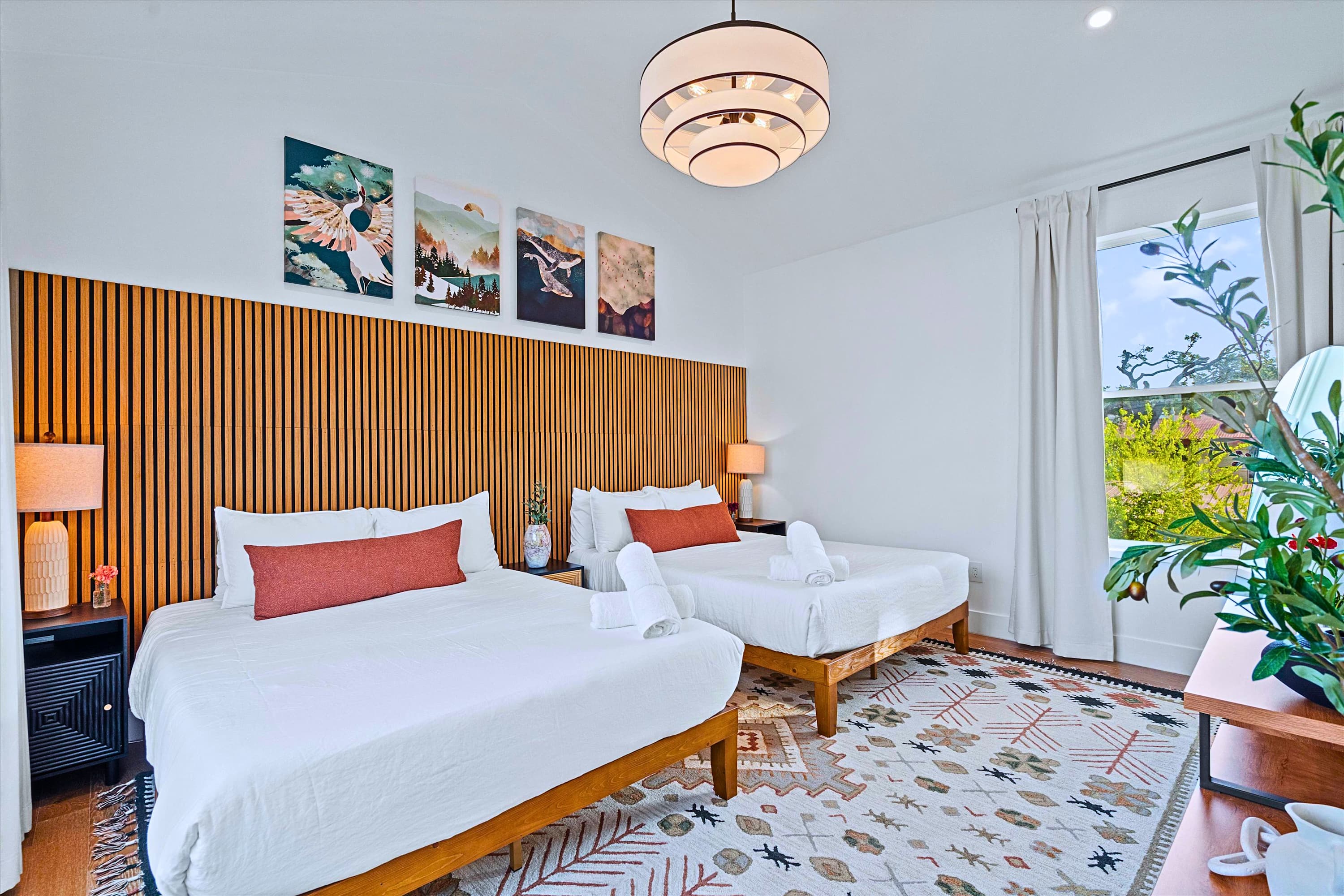 Spacious Room with Two Queen Beds and Modern Accent Lighting