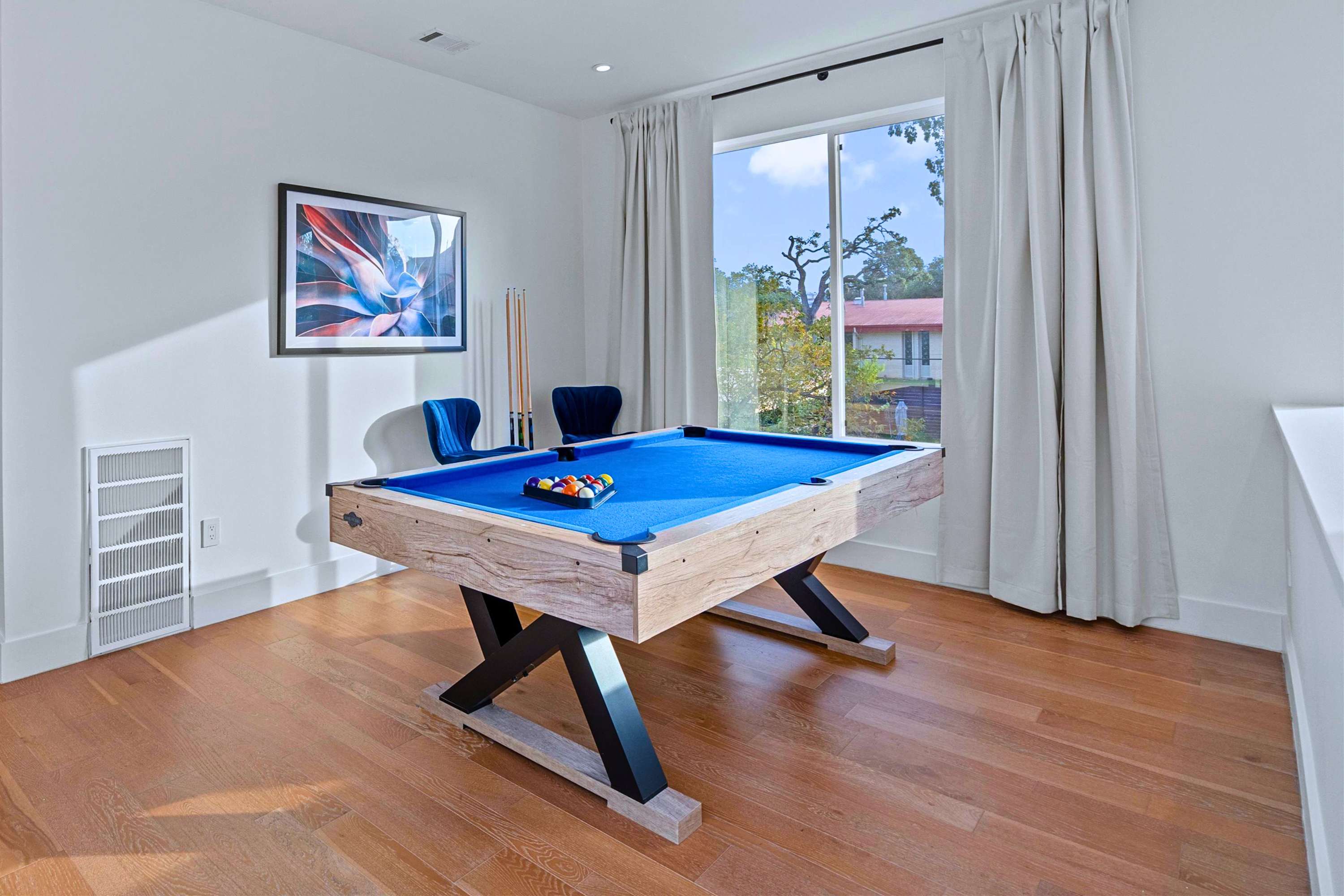 Play Pool Indoors While Enjoying Fresh Air from the Balcony