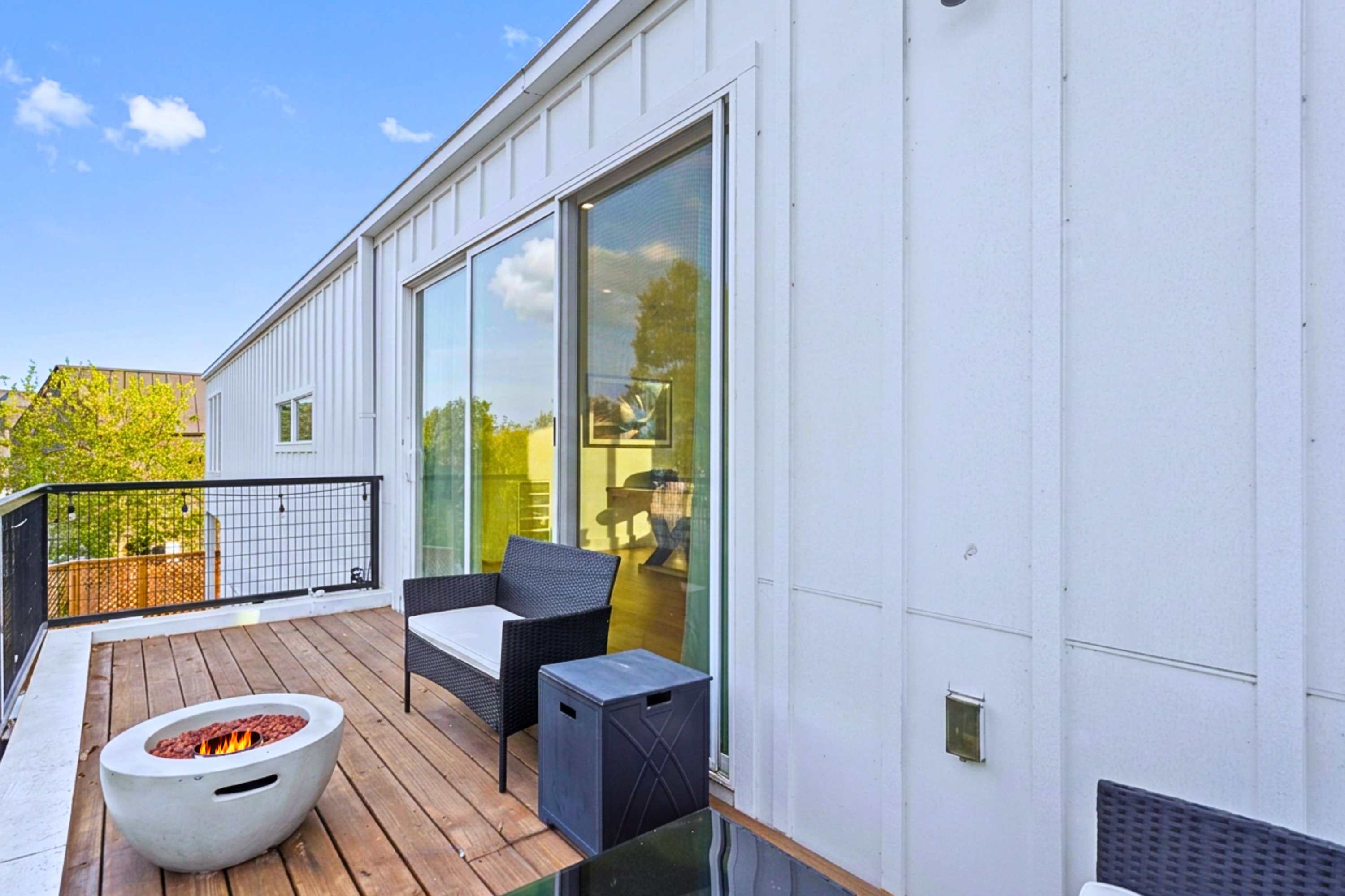 Seamless Entry to Outdoor Balcony Lounge and Firepit