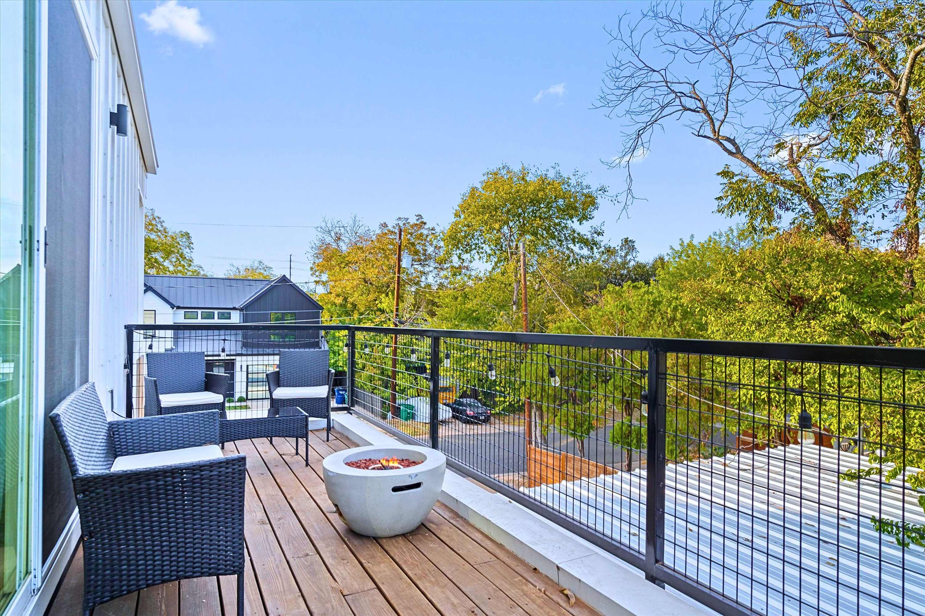 Sip Drinks Under the Stars by the Warm Balcony Firepit