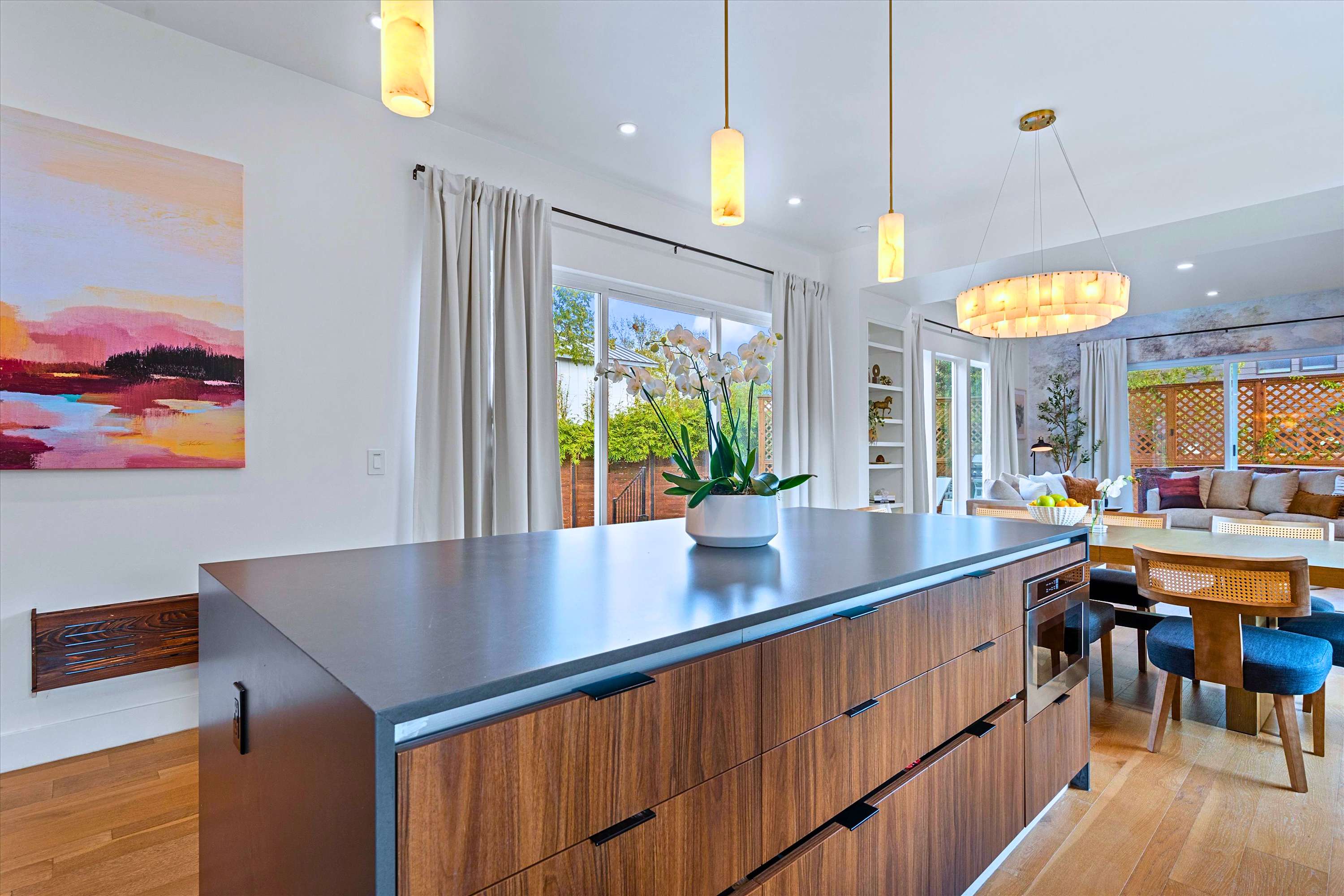Large Designer Island Connected Directly to Dining Area