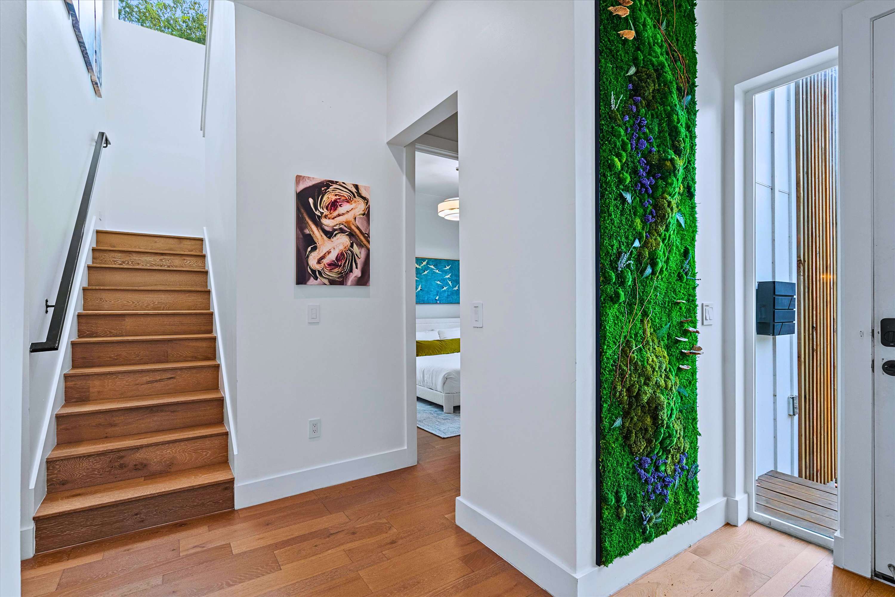 Stunning Moss Wall Entryway with Private Master Suite Access