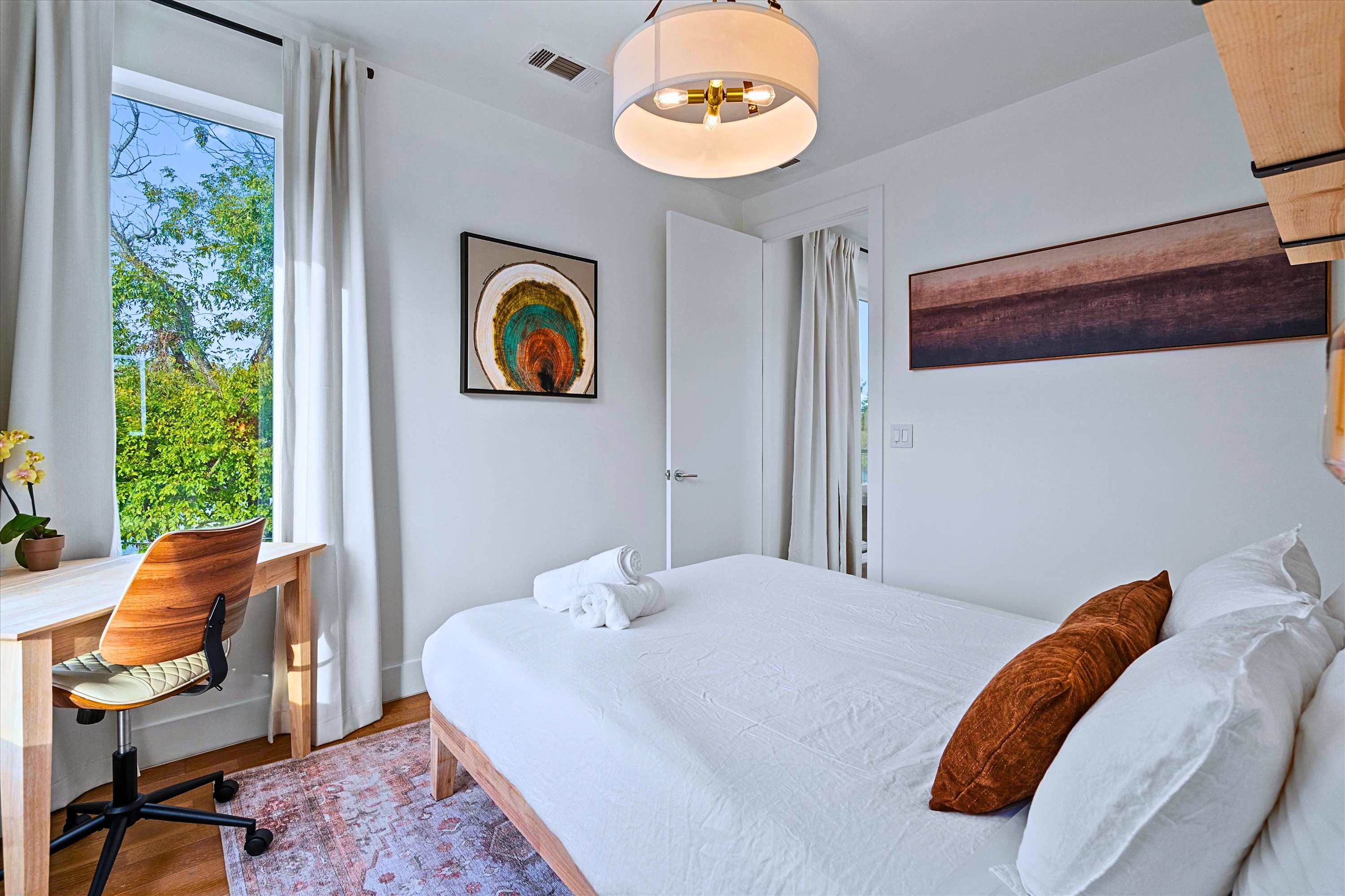 Stay Productive and Sleep Well in This Queen Workspace Suite
