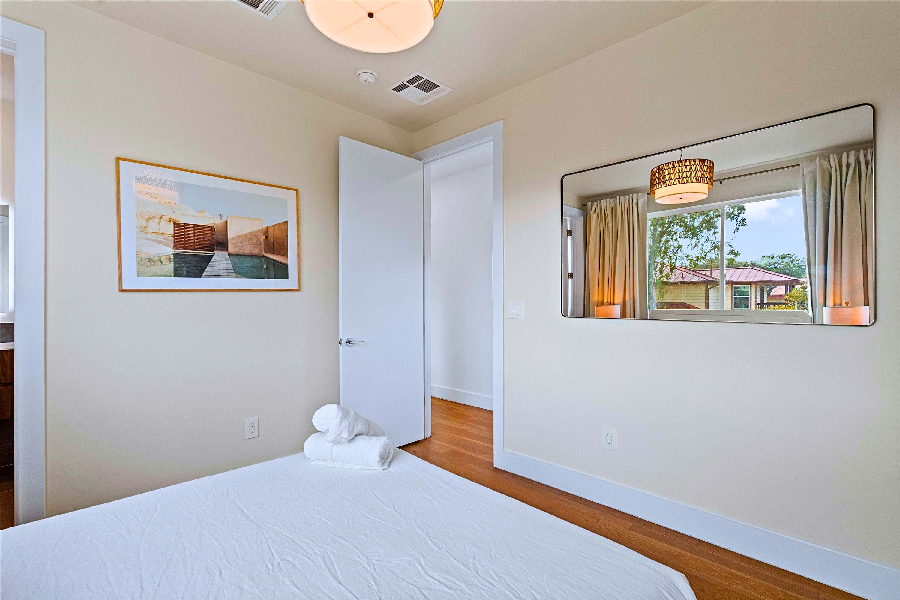 Comfortable Private Guest Room Featuring a Large Mirror