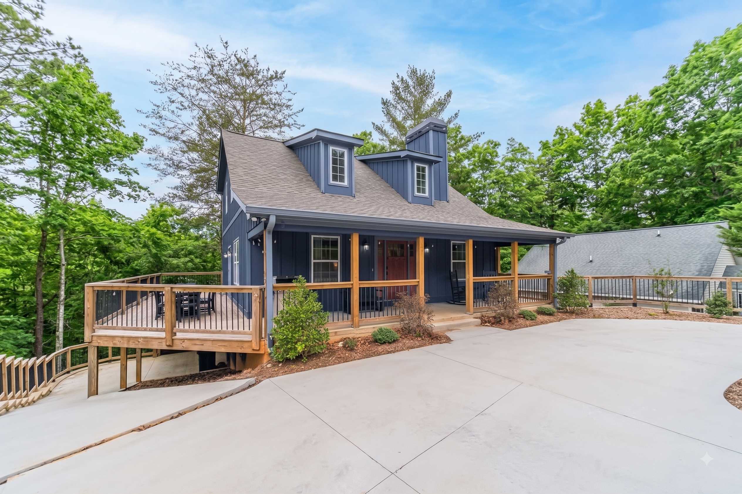 Take in the slate blue siding and charming architectural details.
