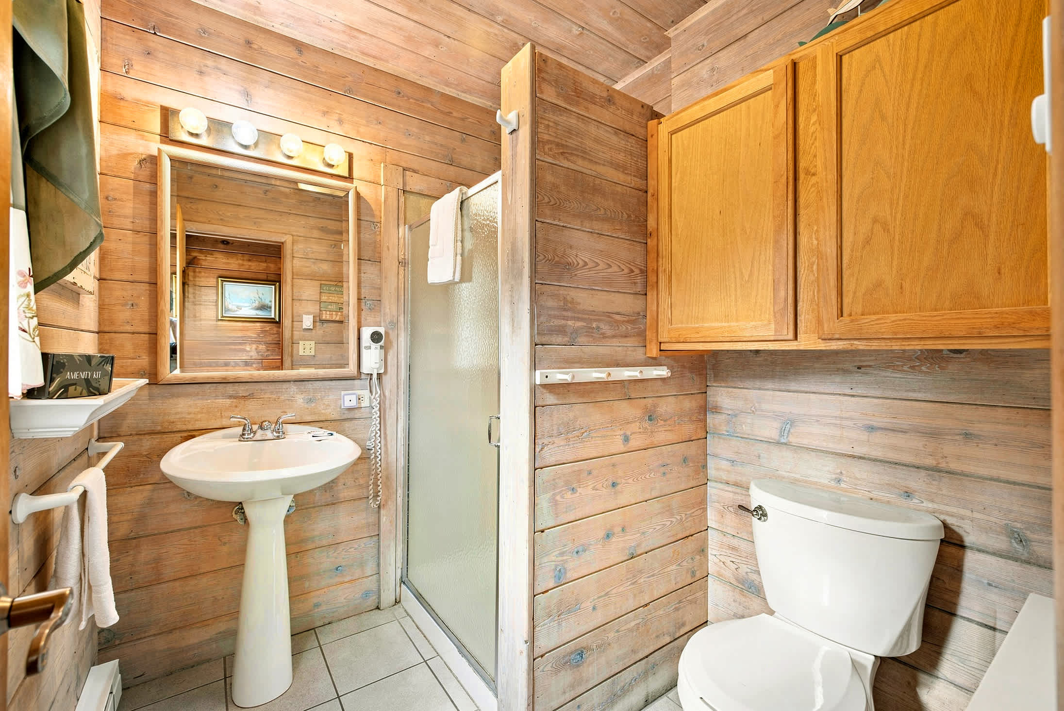 Full bathroom with a walk-in shower for easy guest access.